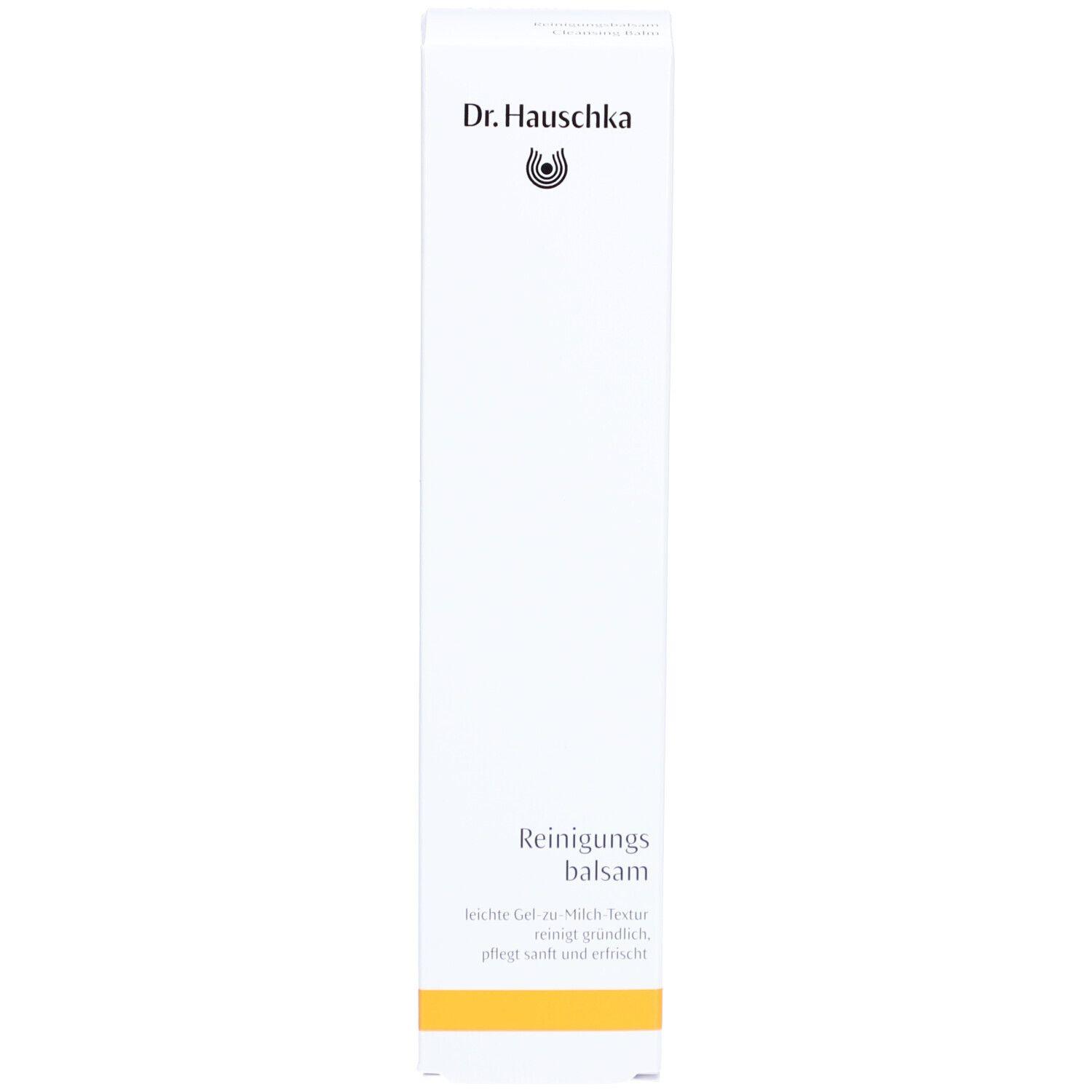 Boîte blanche avec bande jaune. Inscription: Dr. Hauschka, Reinigungsbalsam. Texte en allemand.
