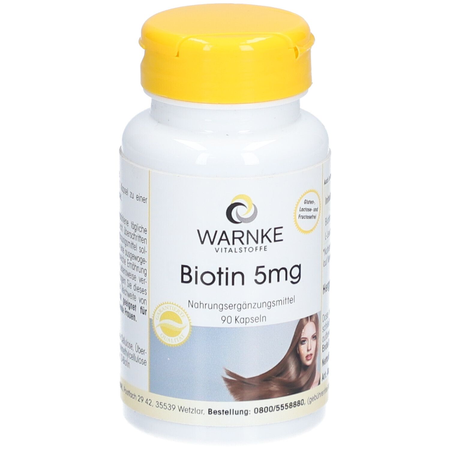 Flacon blanc à bouchon jaune. Inscription: Warnke Vitalstoffe, Biotin 5mg, 90 gélules. Image d'une femme aux cheveux longs.