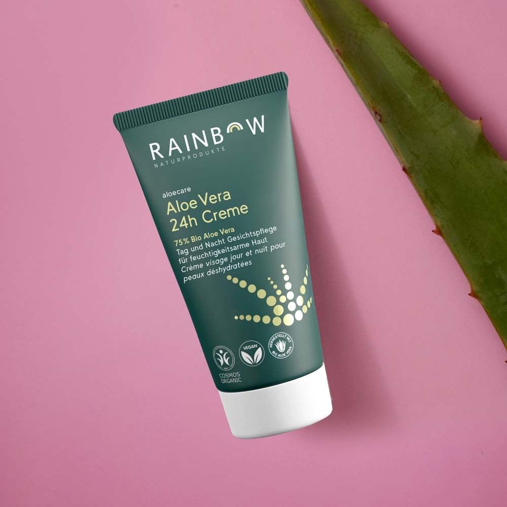 Tube vert avec texte: Rainbow, aloecare, Aloe Vera 24h Creme. Feuille d'aloe vera à côté. Logos et texte.