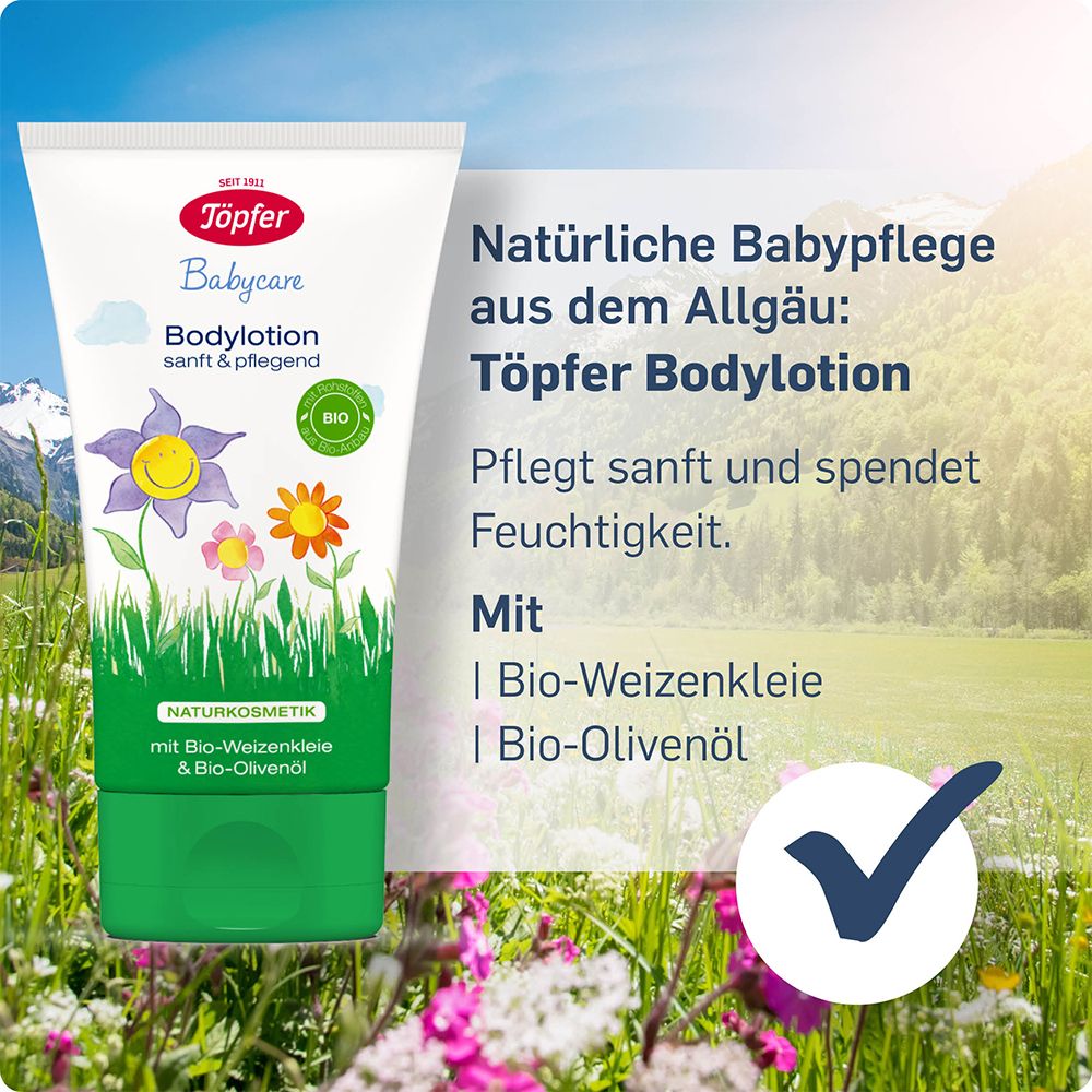 Tube de lotion corporelle Töpfer devant prairie fleurie. Texte: Soin bébé naturel, ingrédients bio.