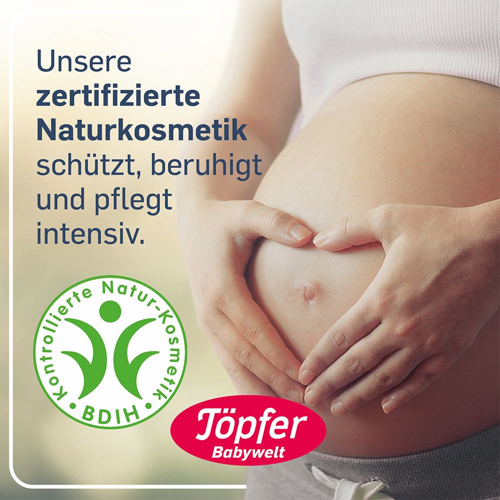 Ventre d'une femme enceinte. Mains en forme de cœur. Logo : Töpfer Babywelt. Cosmétiques naturels certifiés.