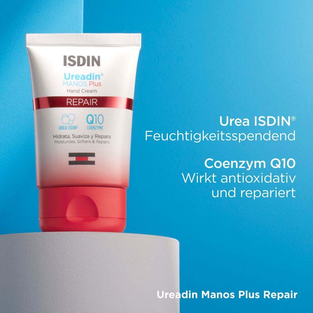 Tube ISDIN Ureadin Manos Plus Repair sur socle. Fond bleu. Texte : Urée ISDIN, Coenzyme Q10.