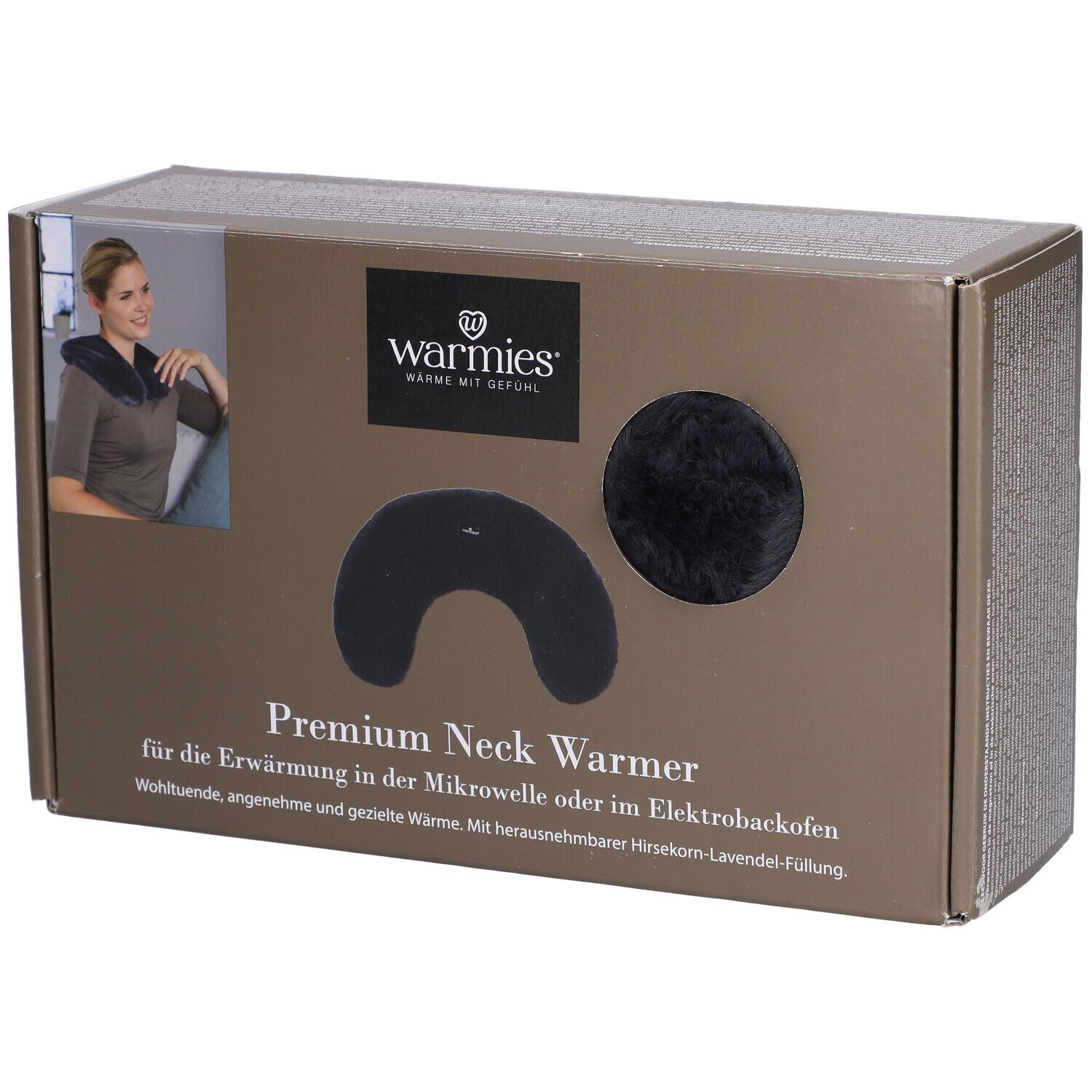 Warmies® chauffe-nuque Premium dans son emballage. Chauffe-nuque noir et élément rond visibles. Texte: Warmies, Premium Neck Warmer.