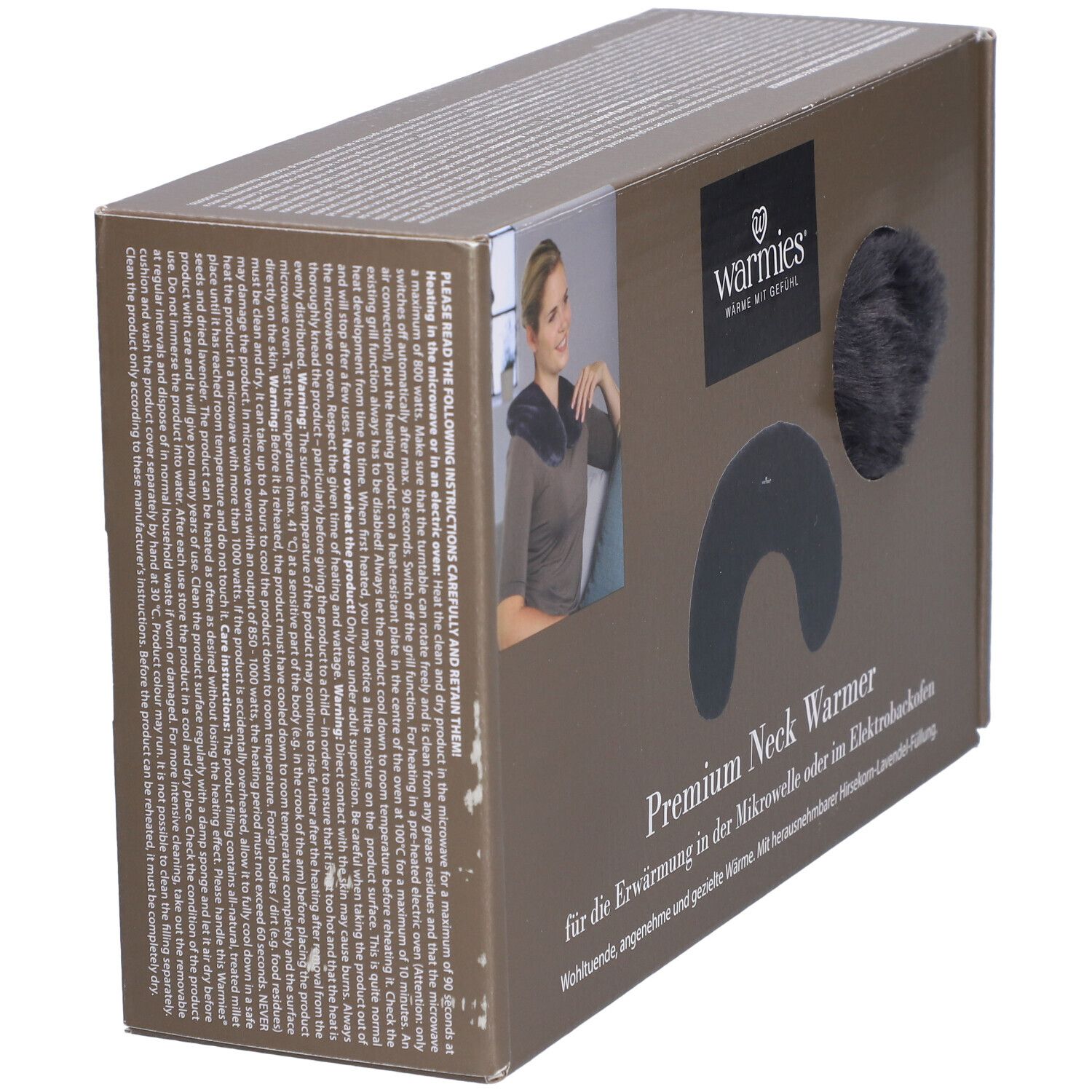 Emballage latéral du chauffe-nuque Premium Warmies®. Chauffe-nuque noir et élément rond visibles. Texte: Warmies, Premium Neck Warmer.