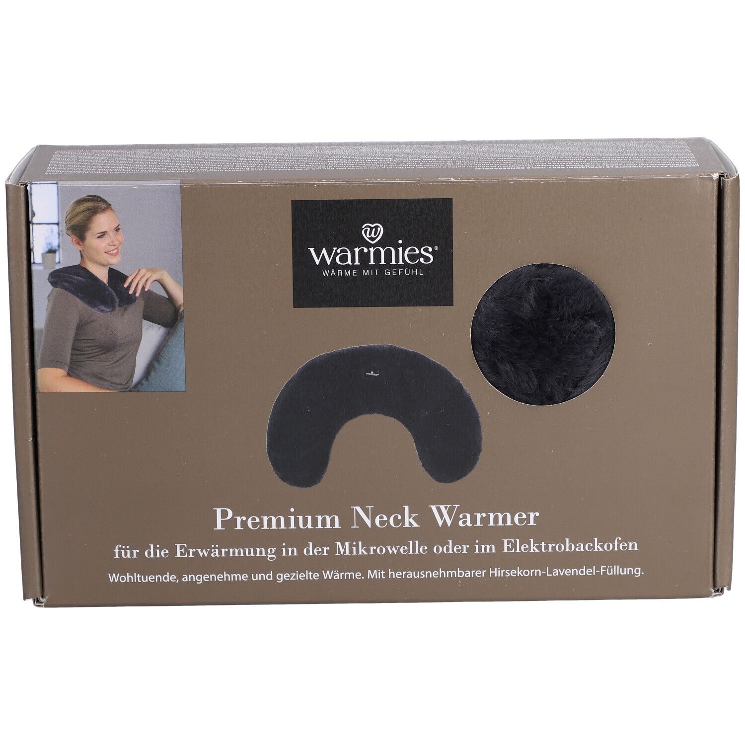 Warmies® chauffe-nuque Premium dans son emballage. Chauffe-nuque noir et élément rond visibles. Texte: Warmies, Premium Neck Warmer.