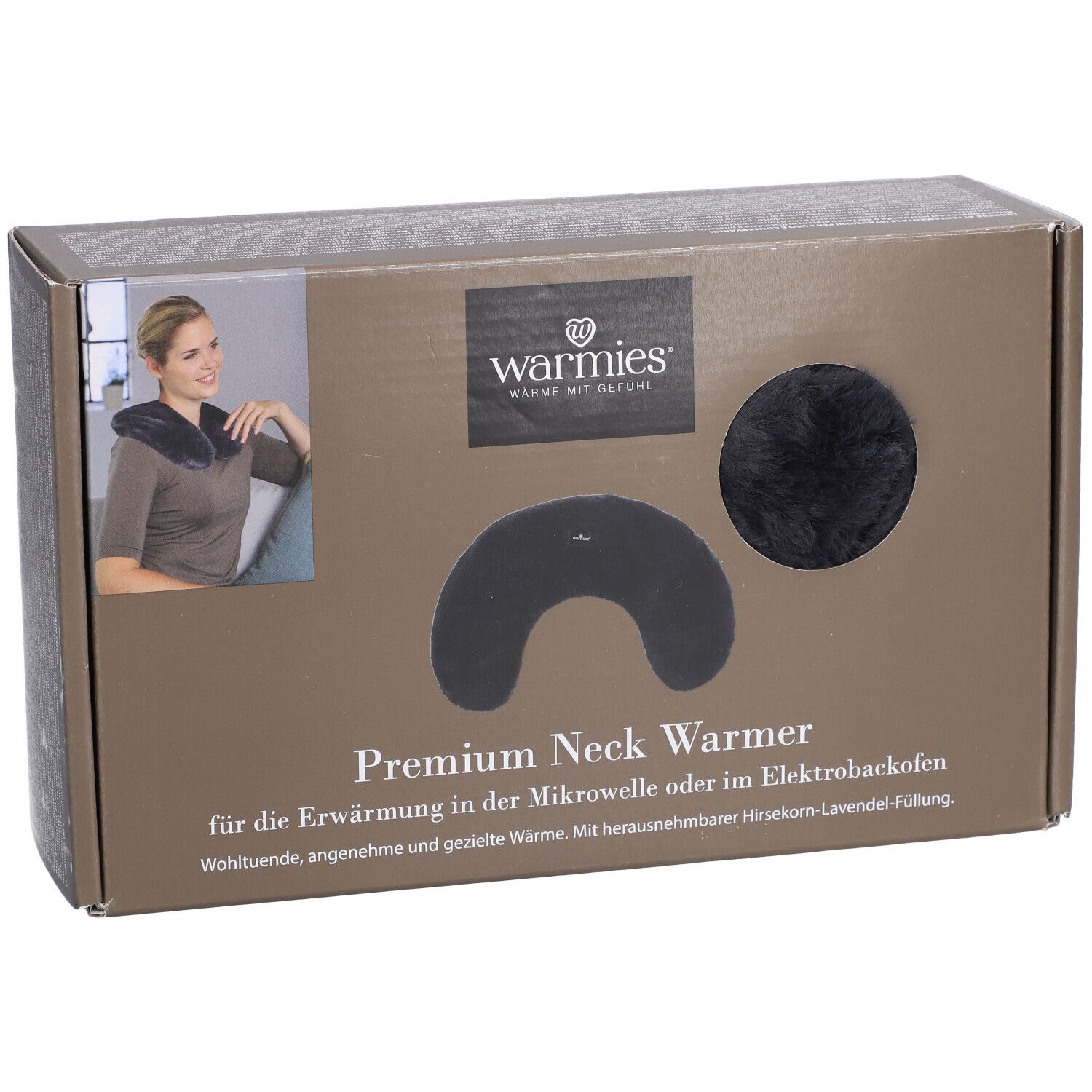 Warmies® chauffe-nuque Premium dans son emballage. Chauffe-nuque noir et élément rond visibles. Texte: Warmies, Premium Neck Warmer.