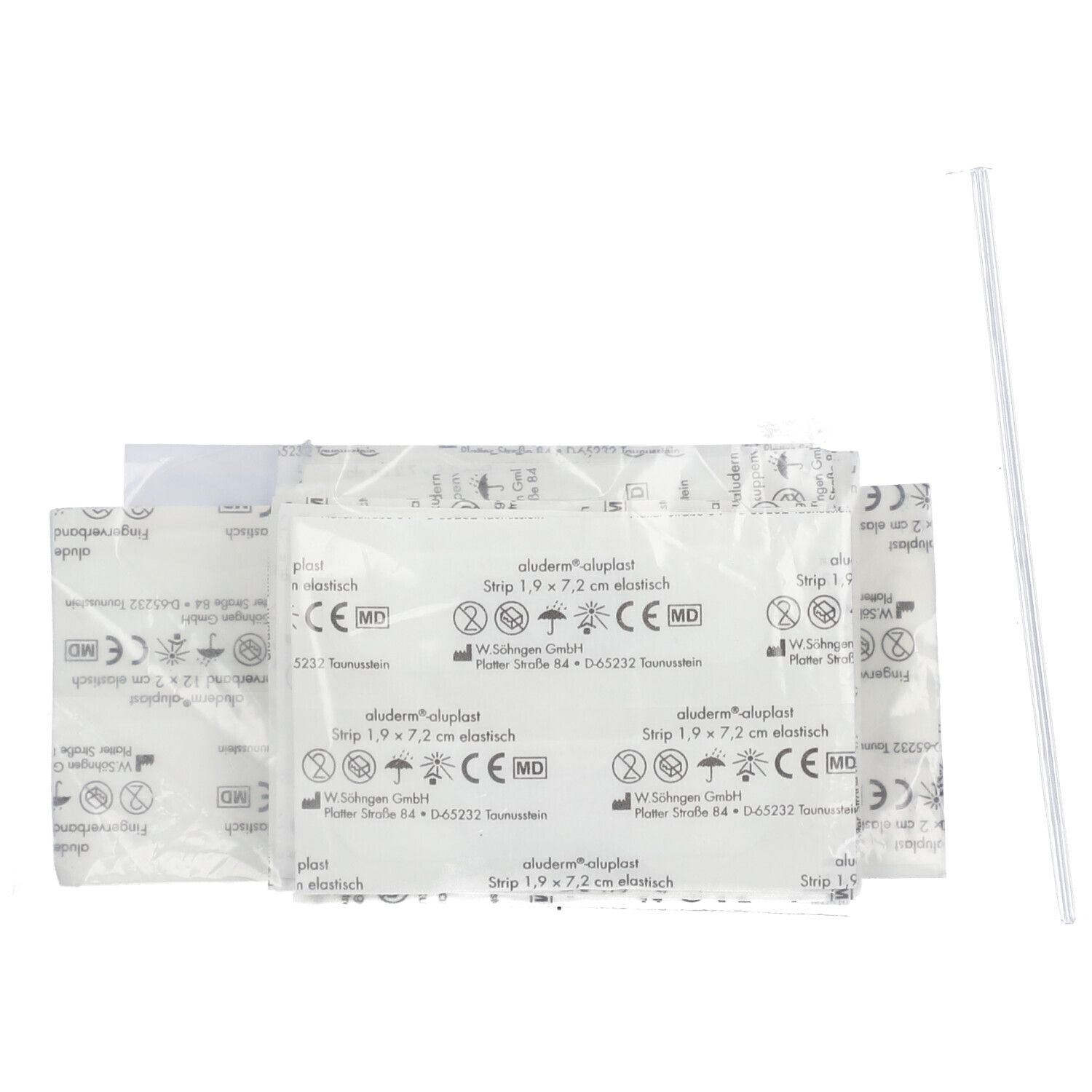 Pansements aluderm®-aluplast emballés individuellement. Emballage blanc avec texte bleu. Un applicateur individuel à côté.