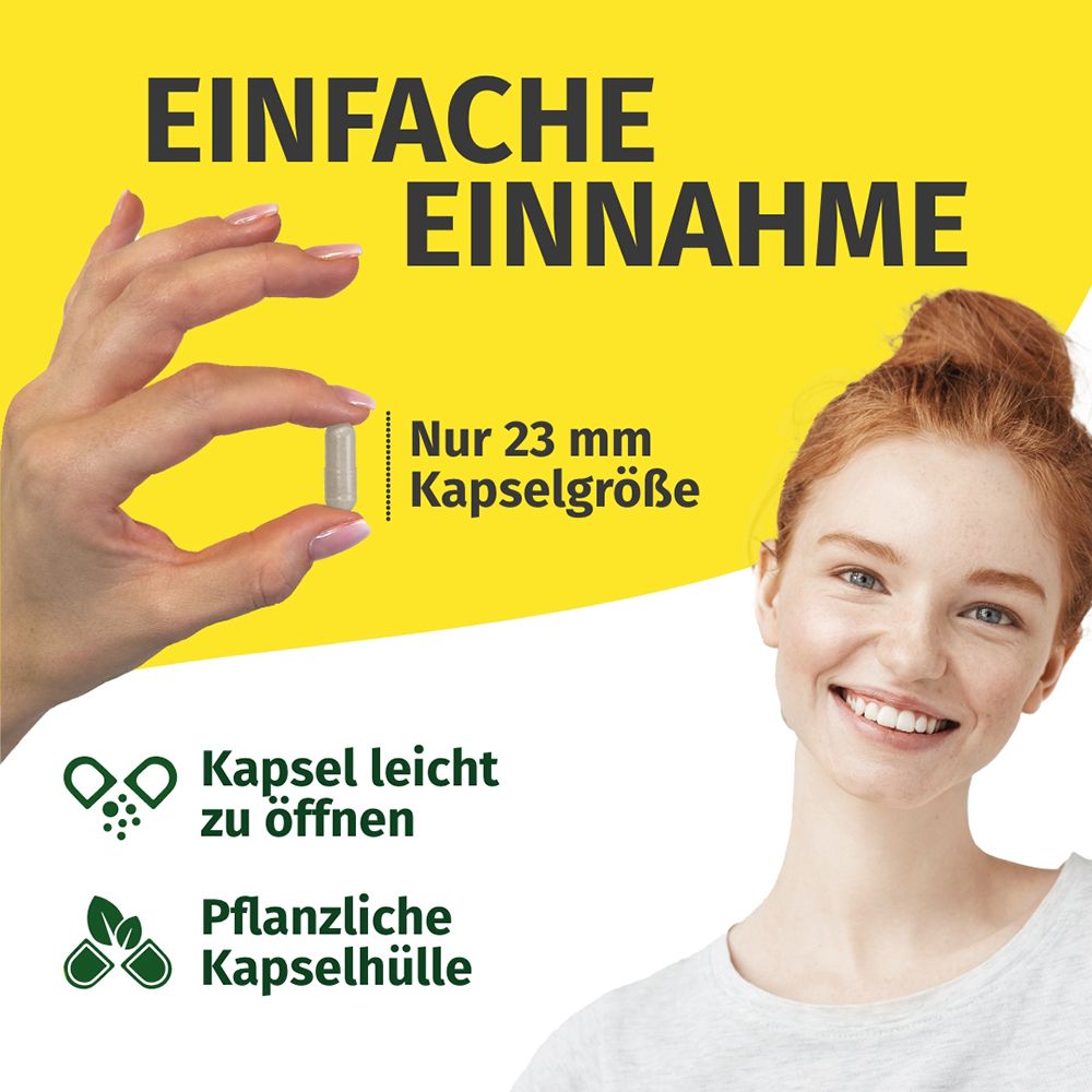 Femme tenant une gélule (23 mm) sur fond jaune. "Prise facile".
