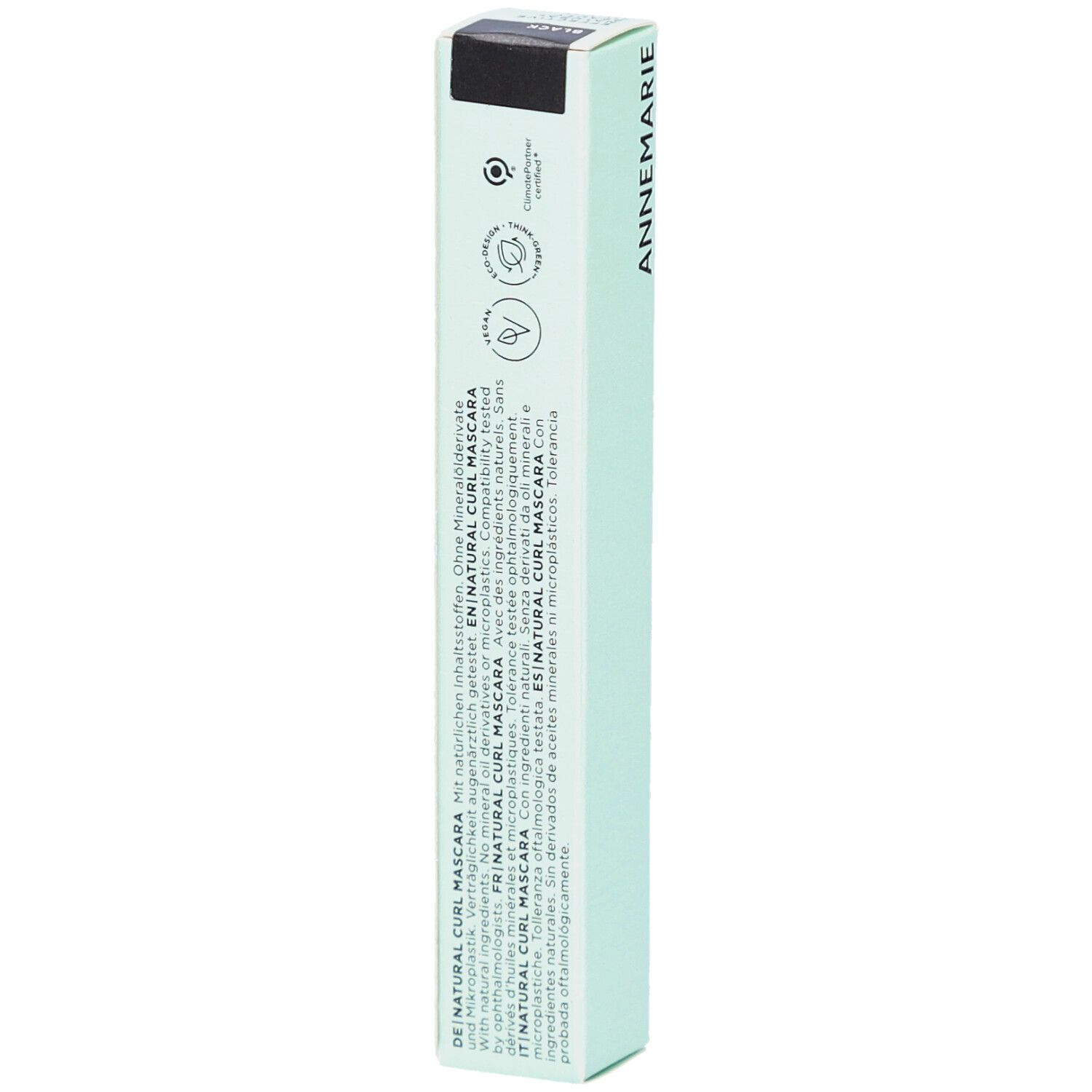 Emballage vert avec textes multilingues. Texte: Natural Curl Mascara. Certifications et logos.