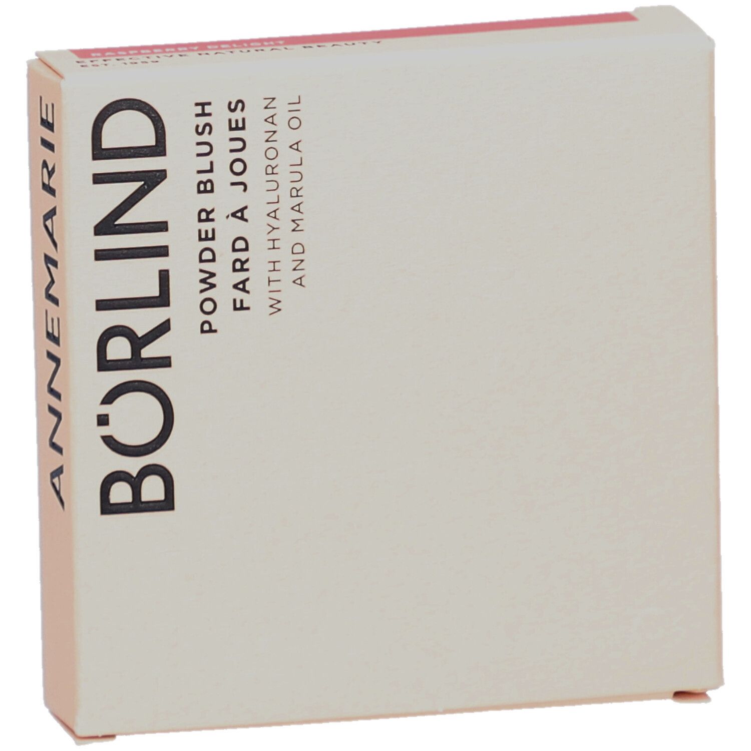 Boîte en carton, légèrement inclinée. Inscription : ANNEMARIE BÖRLIND, Powder Blush, Fard à Joues, avec Hyaluron et huile de Marula.