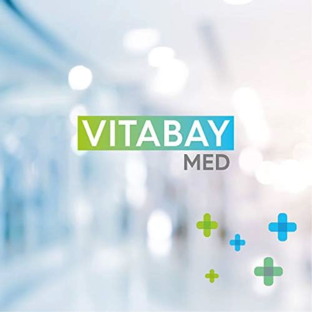 Logo VITABAY MED avec des croix vertes et bleues sur fond flou.