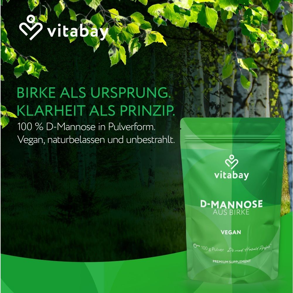 Vitabay D-Mannose de bouleau dans une pochette devant un fond de forêt de bouleaux.
