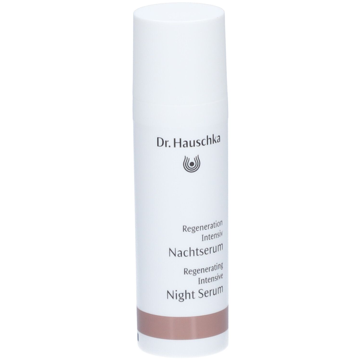 Flacon blanc Dr. Hauschka, sérum de nuit régénérant. Inscription et bande marron en bas.
