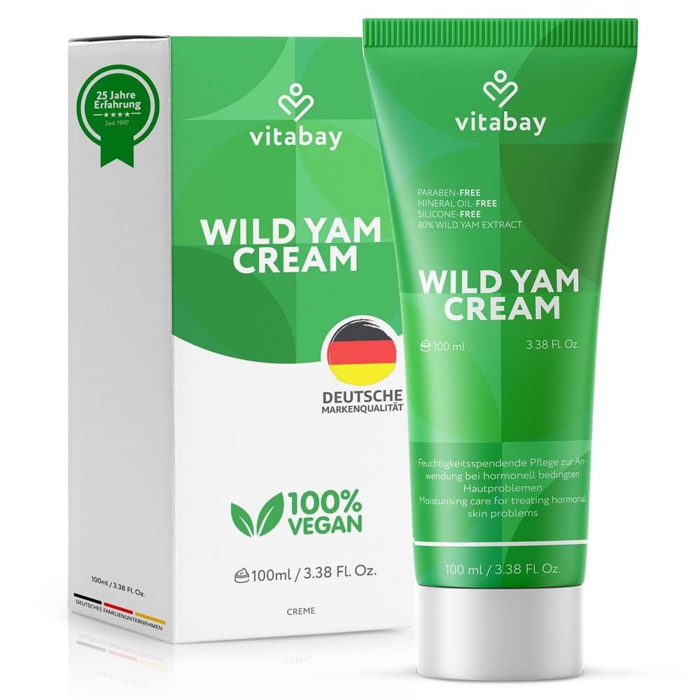 Tube et boîte verts avec "Wild Yam Cream". Crème 100% végétalienne. Qualité de marque allemande.