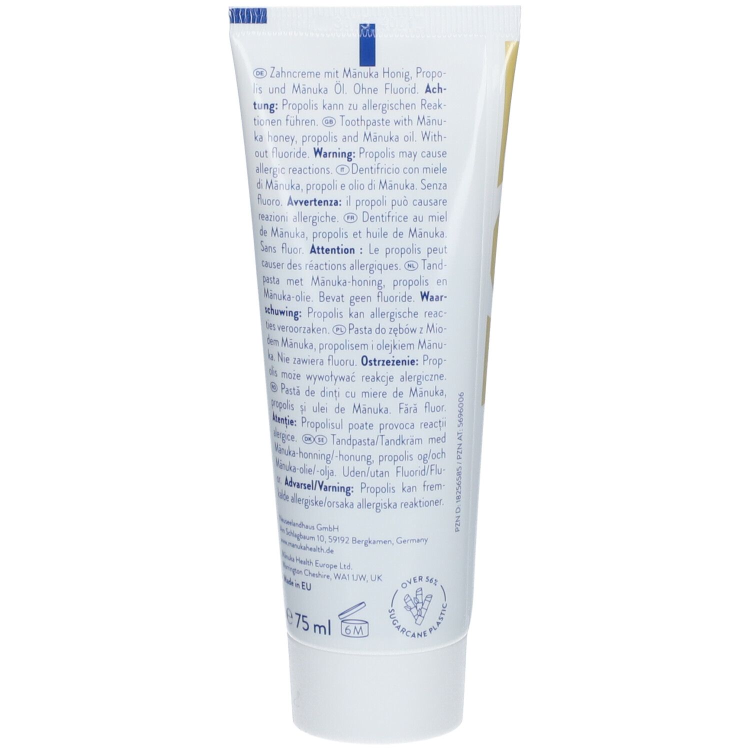 Dos du tube de dentifrice. Texte multilingue: avertissements, ingrédients, informations fabricant, volume 75 ml.