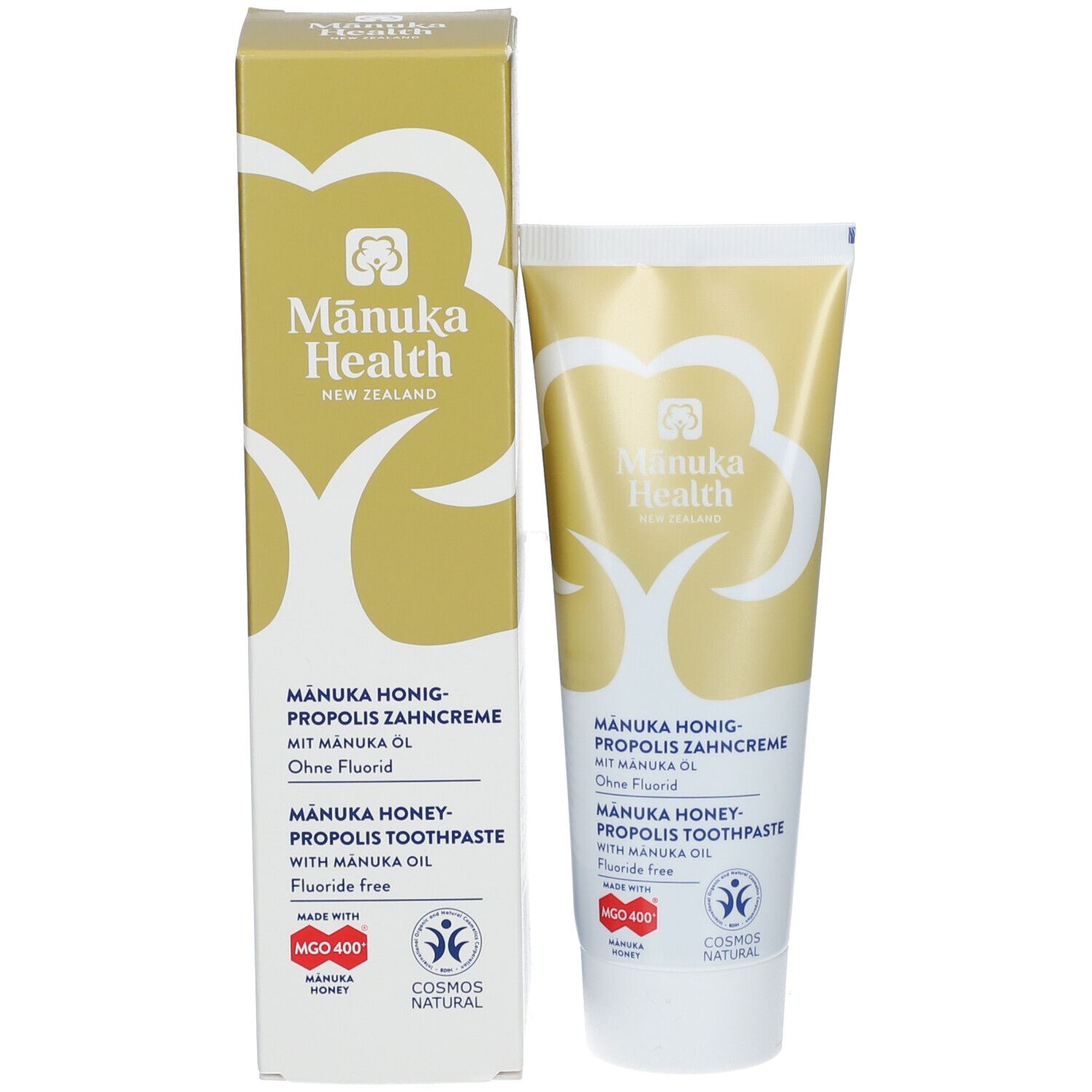Tube de dentifrice et carton. Inscription: Manuka Health, Manuka Honig-Propolis Zahncreme, sans fluor. Logos et certifications.