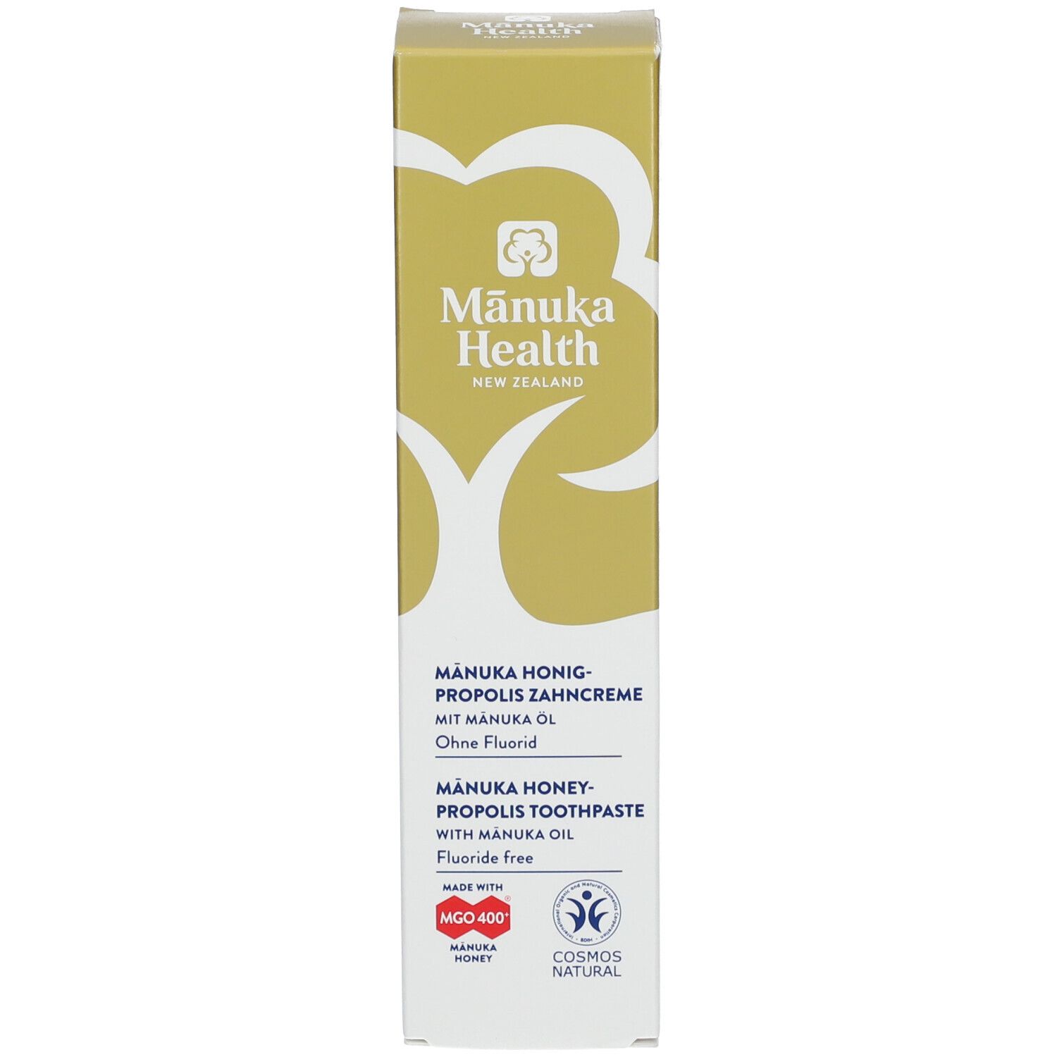 Boîte de dentifrice. Inscription: Manuka Health, Manuka Honig-Propolis Zahncreme, sans fluor. Logos et certifications.