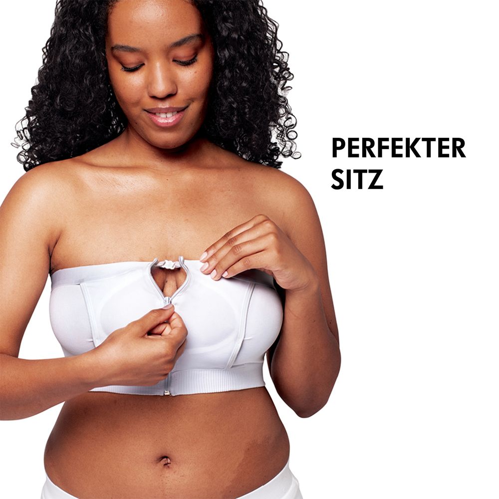 Femme portant un bustier blanc avec fermeture éclair. Texte : PERFEKTER SITZ.