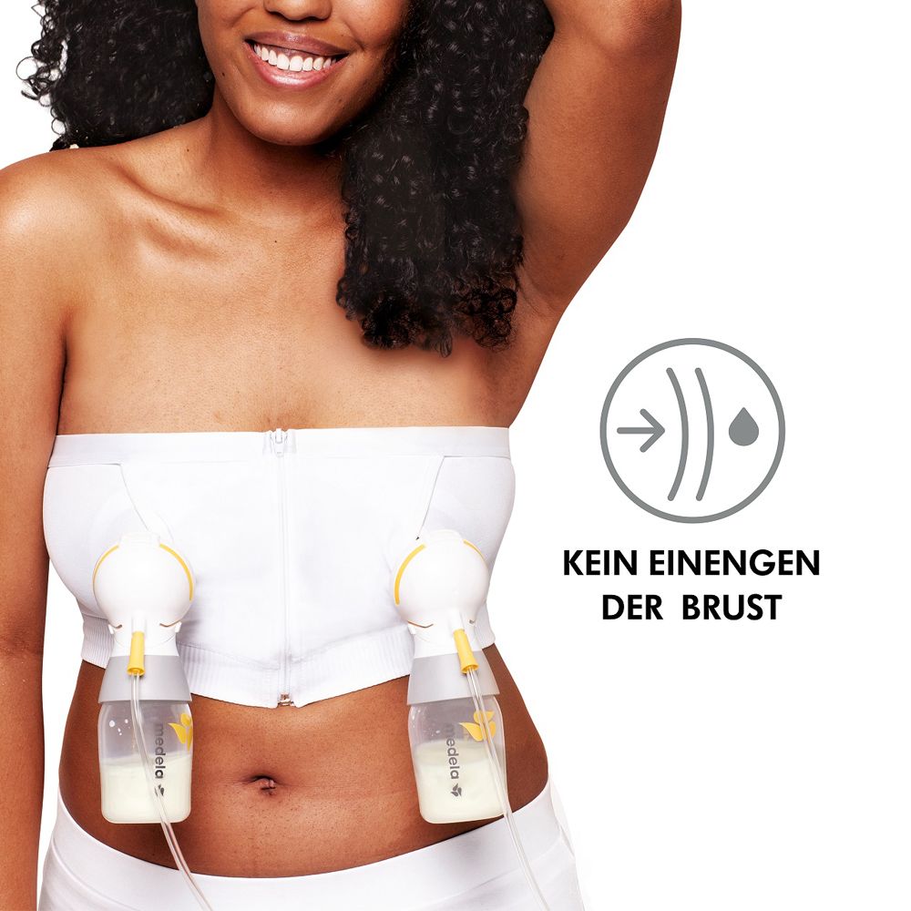 Femme avec bustier blanc et deux tire-lait. Texte : KEIN EINENGEN DER BRUST.