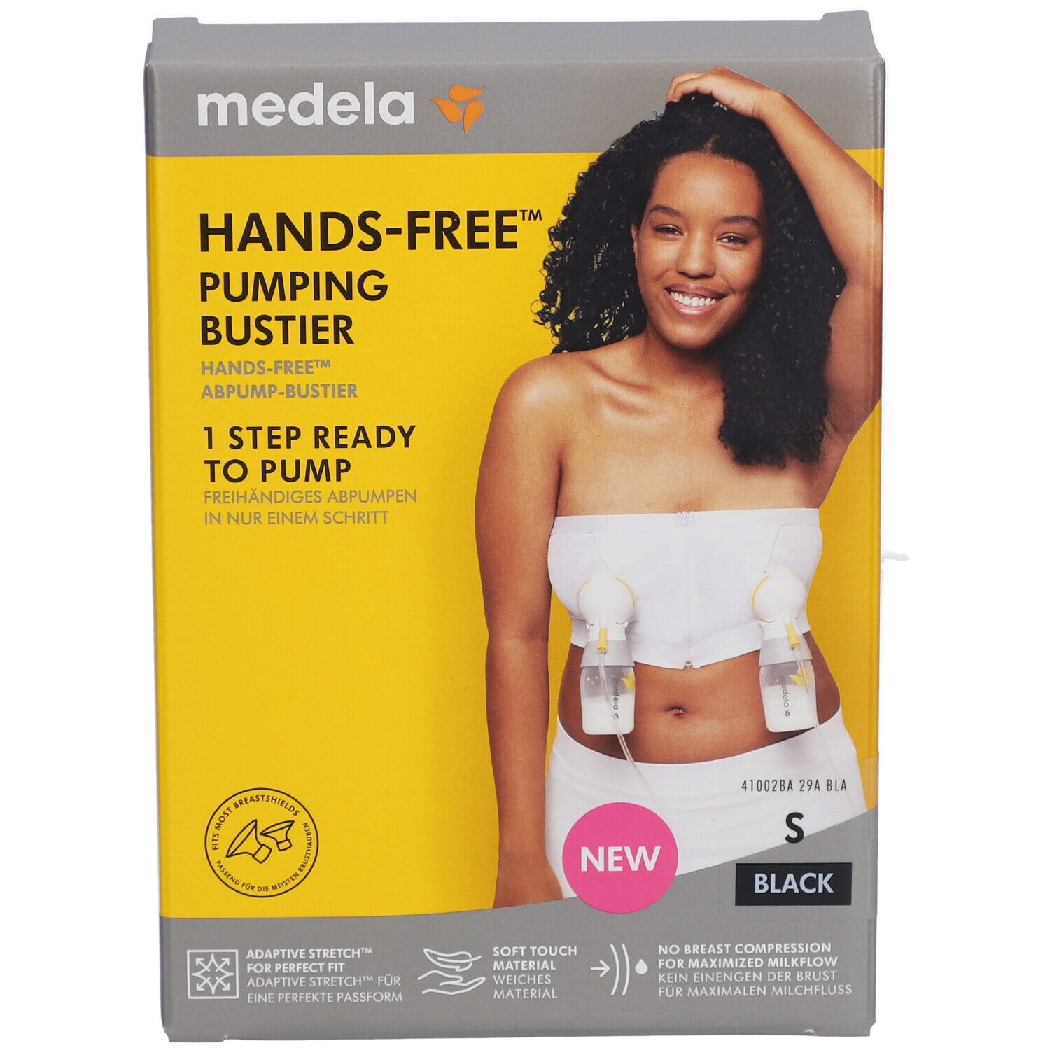 Emballage avec image du produit. Bustier mains libres, taille S, noir. Marque Medela. Fond jaune.
