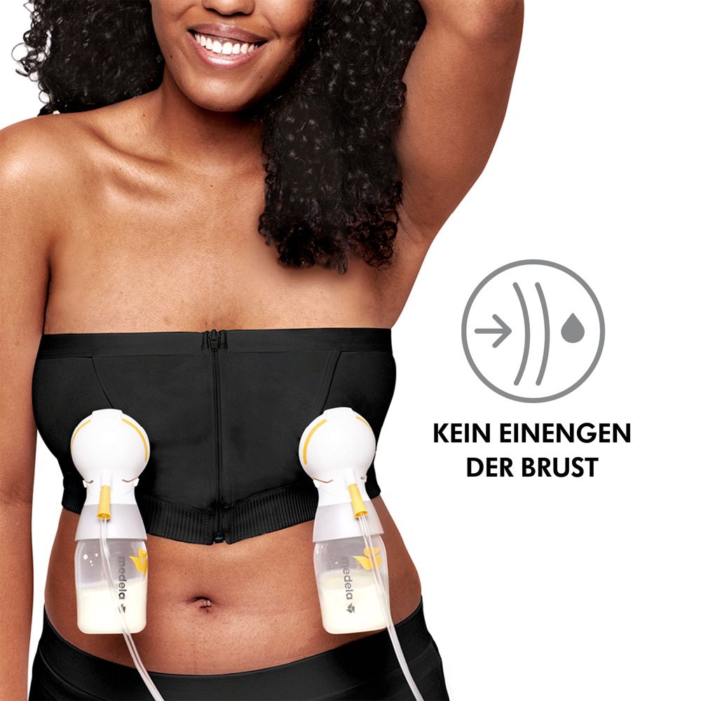 Bustier noir avec deux tire-lait. Femme aux cheveux noirs. Fond blanc. Pas de compression mammaire.