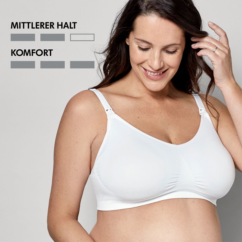 Une femme porte un soutien-gorge d'allaitement blanc. Des symboles de maintien et de confort sont à gauche.