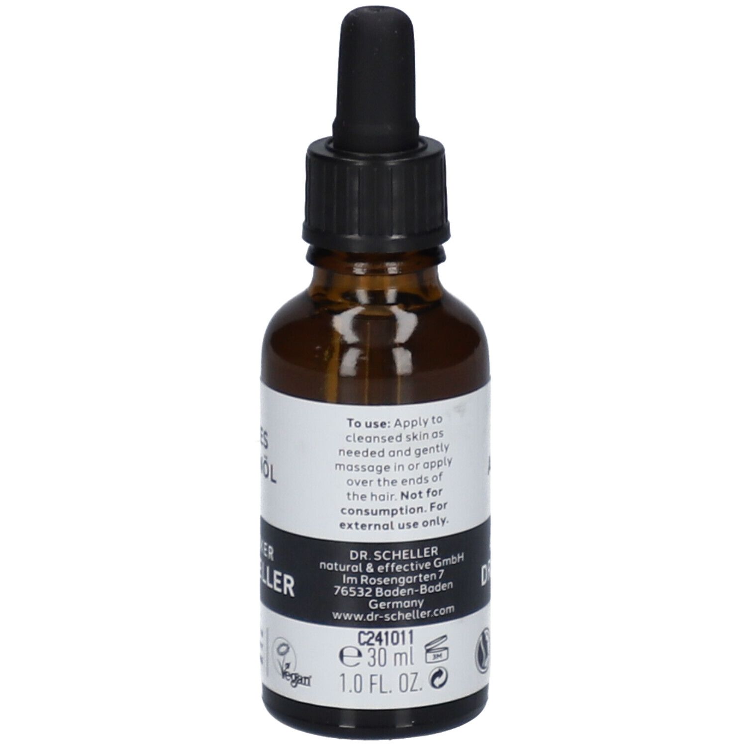 Flacon en verre brun avec bouchon noir et pipette. Étiquette avec texte et "DR. SCHELLER". 30 ml.
