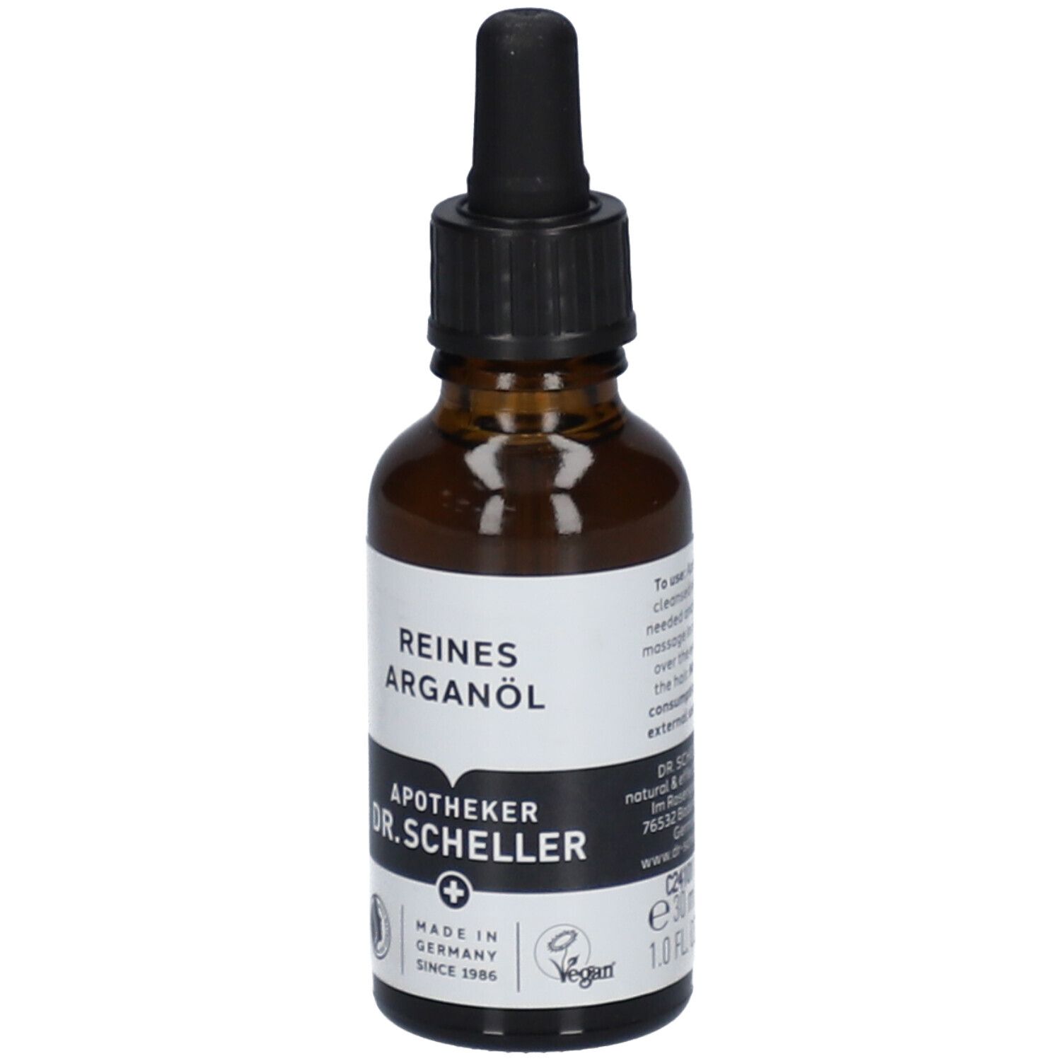 Flacon en verre brun avec bouchon noir et pipette. Étiquette avec "REINES ARGANÖL" et "APOTHEKER DR.SCHELLER".