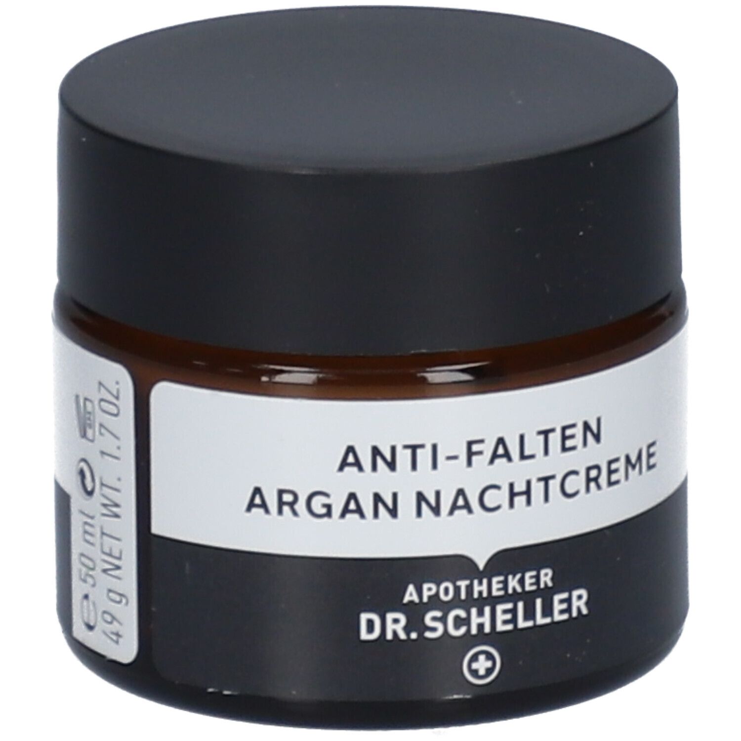 Pot de crème de nuit anti-rides à l'argan. Verre brun, couvercle noir. Étiquette blanche avec nom du produit.