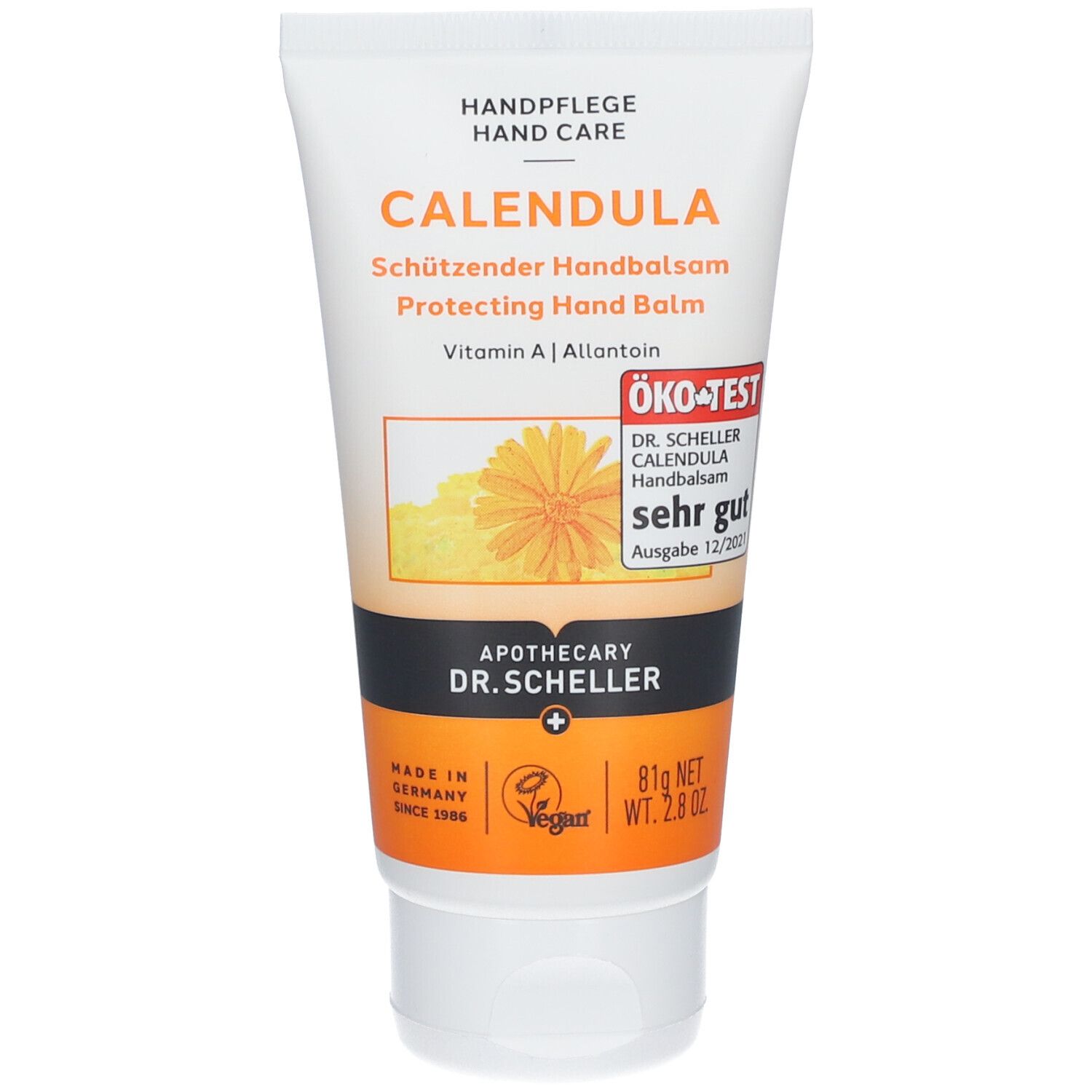 Tube blanc de baume pour les mains CALENDULA avec label ÖKO-TEST. Graphique orange avec fleur. Bande noire avec logo pharmacie.