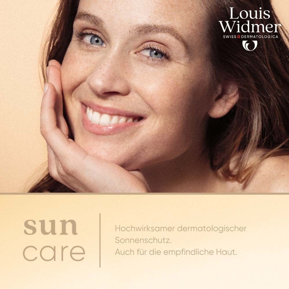 Femme souriante aux yeux bleus. Logo Louis Widmer. Texte: Sun care. Protection solaire dermatologique. Pour peaux sensibles.