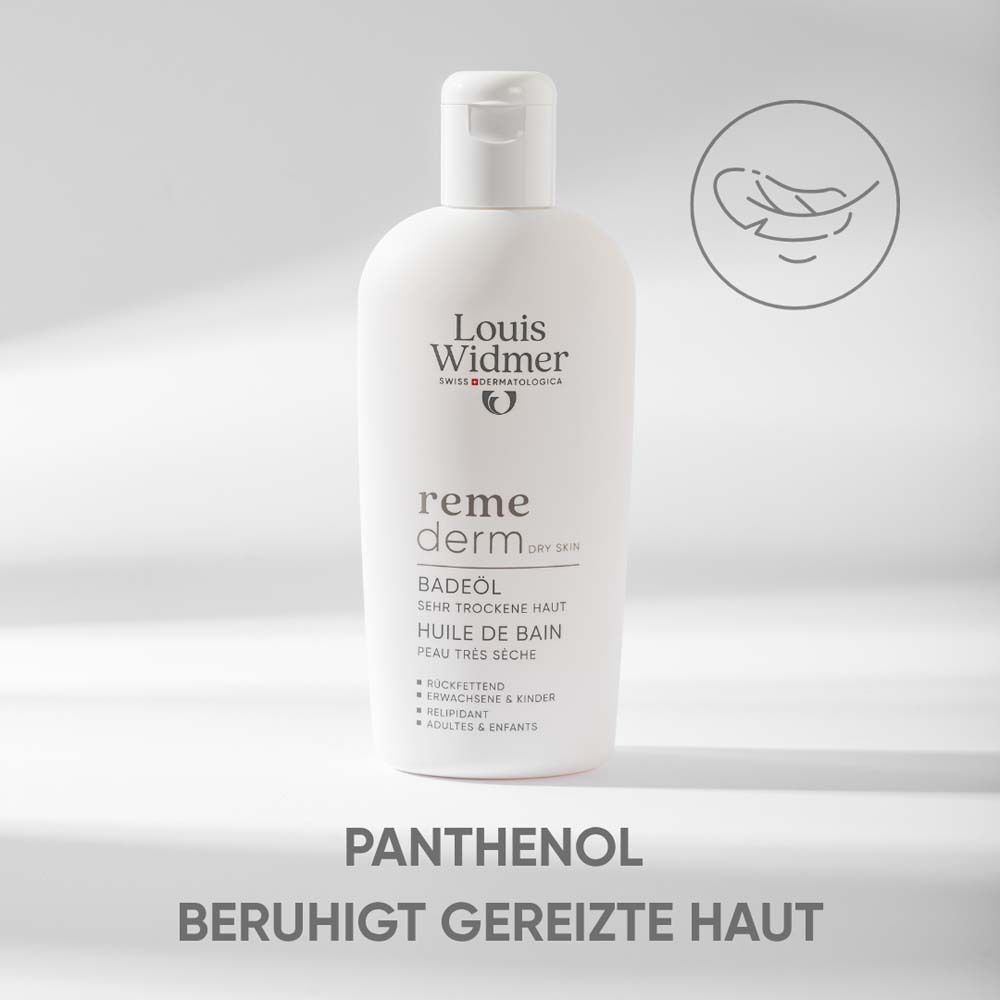 Flacon blanc d'huile de bain. Texte: Louis Widmer, remederm, huile de bain, peau très sèche. Texte: Le panthénol apaise la peau irritée.