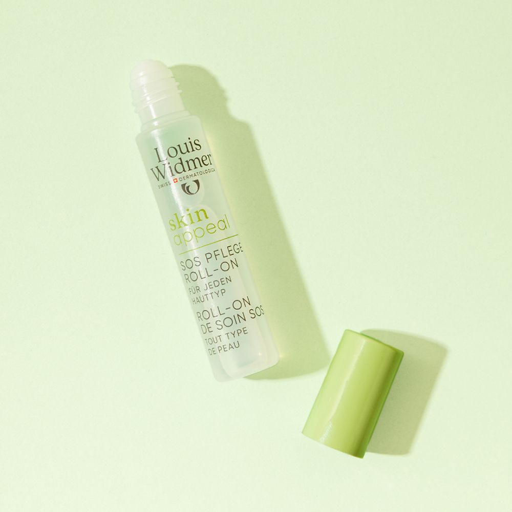Louis Widmer skinappeal Roll-on SOS Soin, non parfumé. Capuchon vert à côté, sur fond clair.