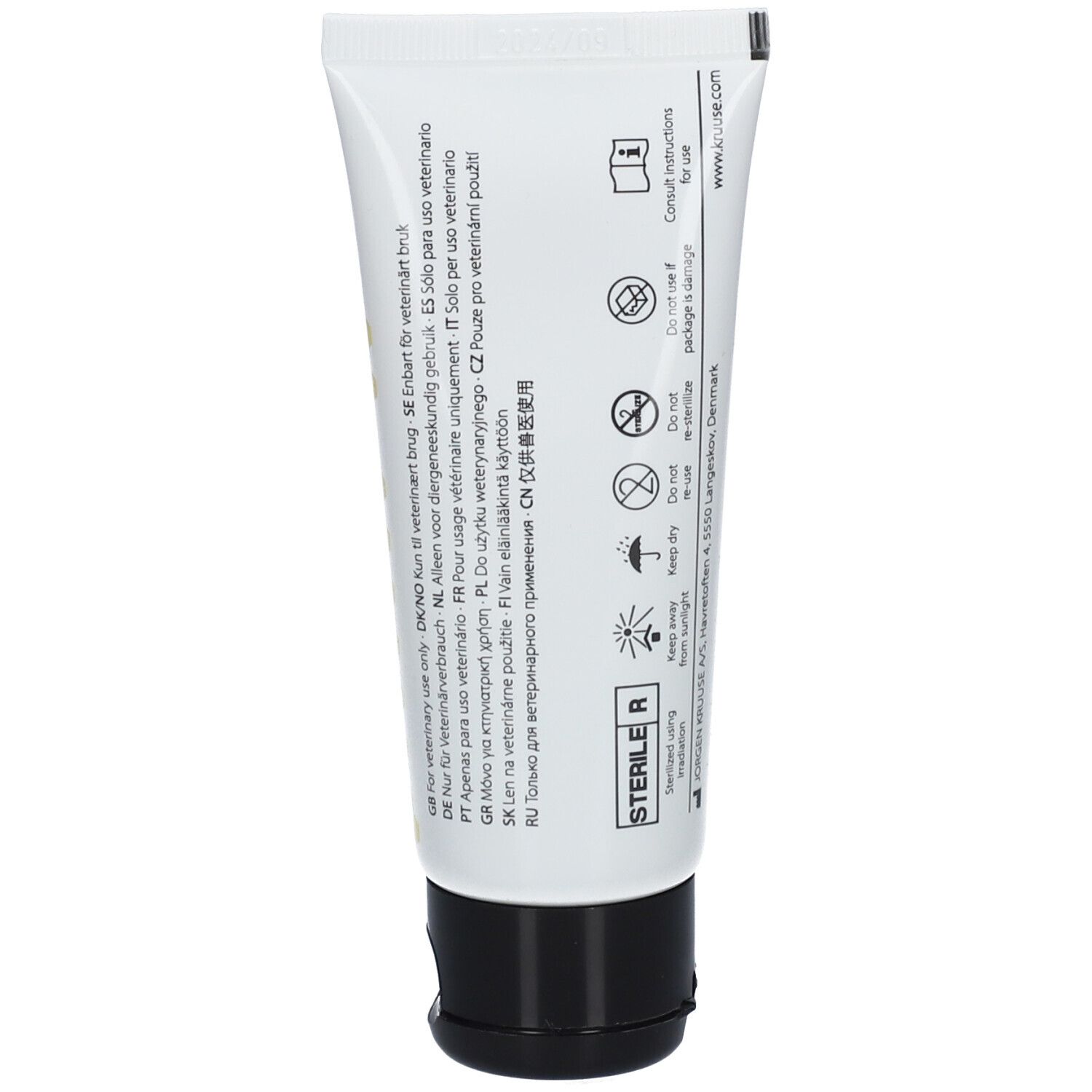 Dos du tube KRUUSE Manuka G. Texte multilingue. Symbole stérile. Instructions d'utilisation.