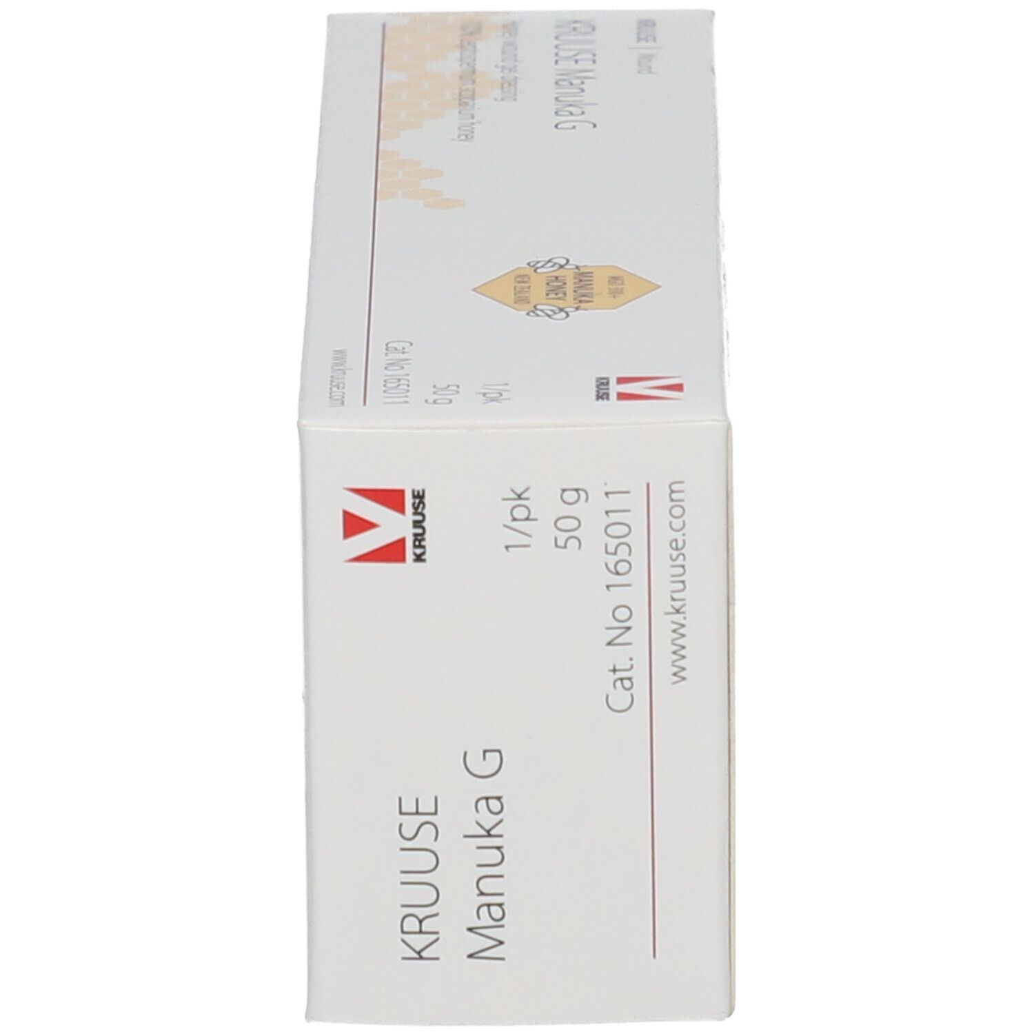 Côté de l'emballage KRUUSE Manuka G. Nom du produit, 50 g, numéro de lot, informations fabricant.