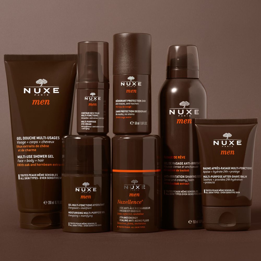 Divers produits NUXE Men : gel douche, déodorant, baume après-rasage, shampooing, etc. Emballages bruns.