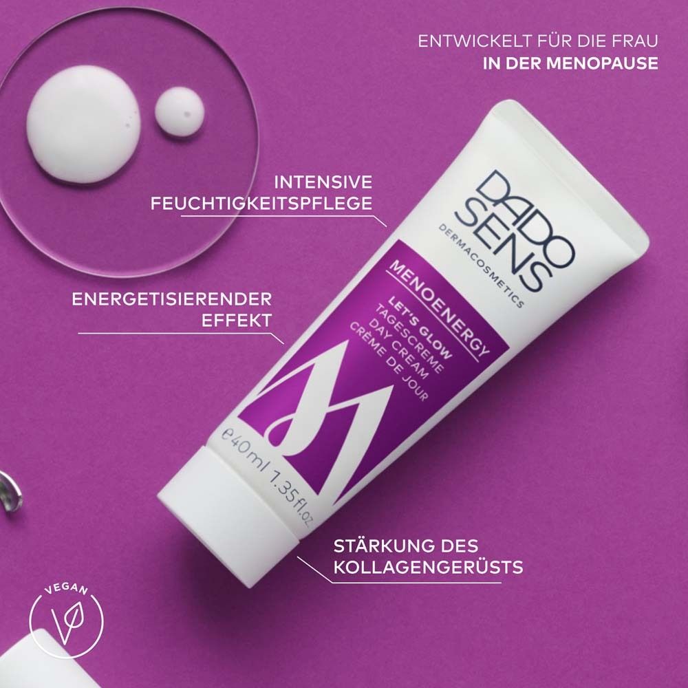 Tube avec accents violets, gouttes de crème. Texte: MENOENERGY, LET'S GLOW Day Cream. Logo végan.