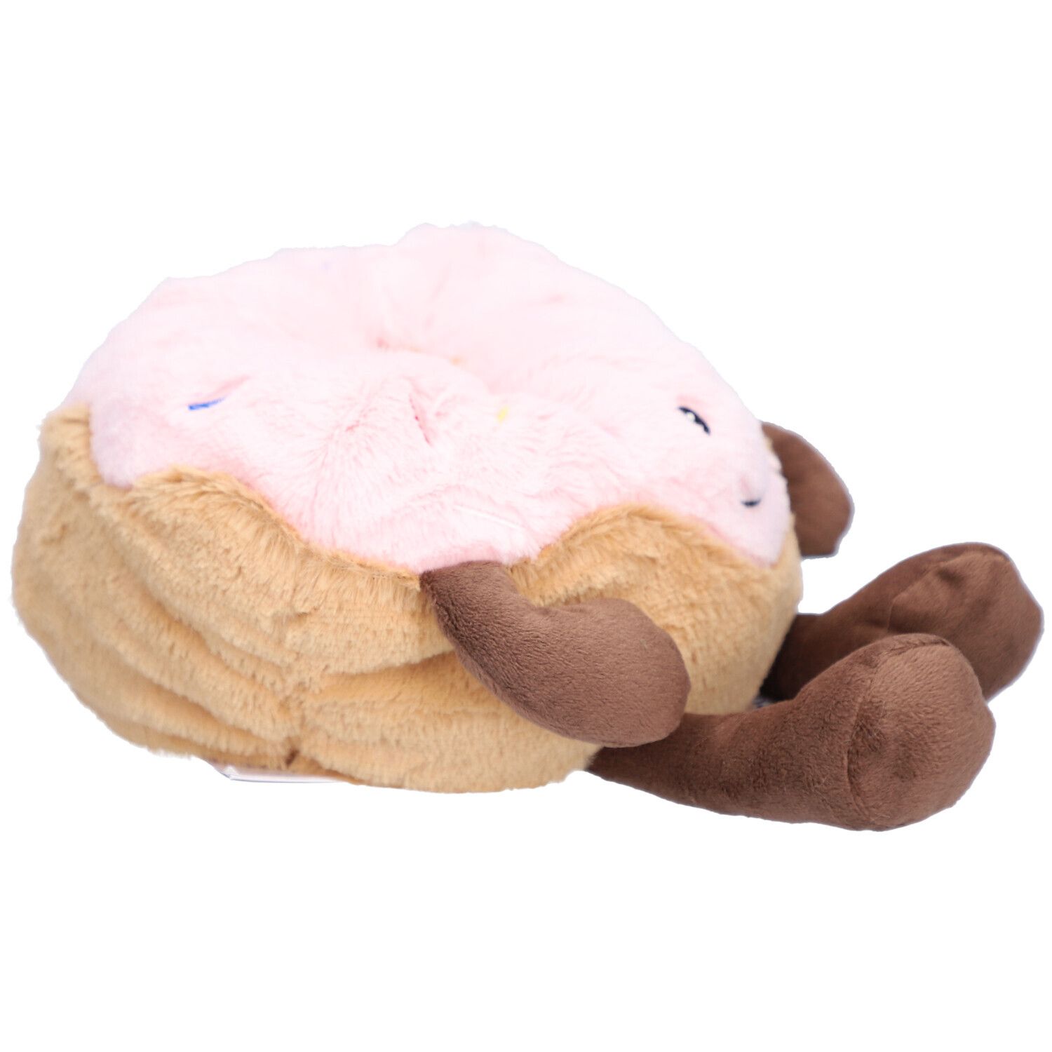 Donut en peluche, glaçage rose, base et bras bruns. Position couchée. Yeux fermés.