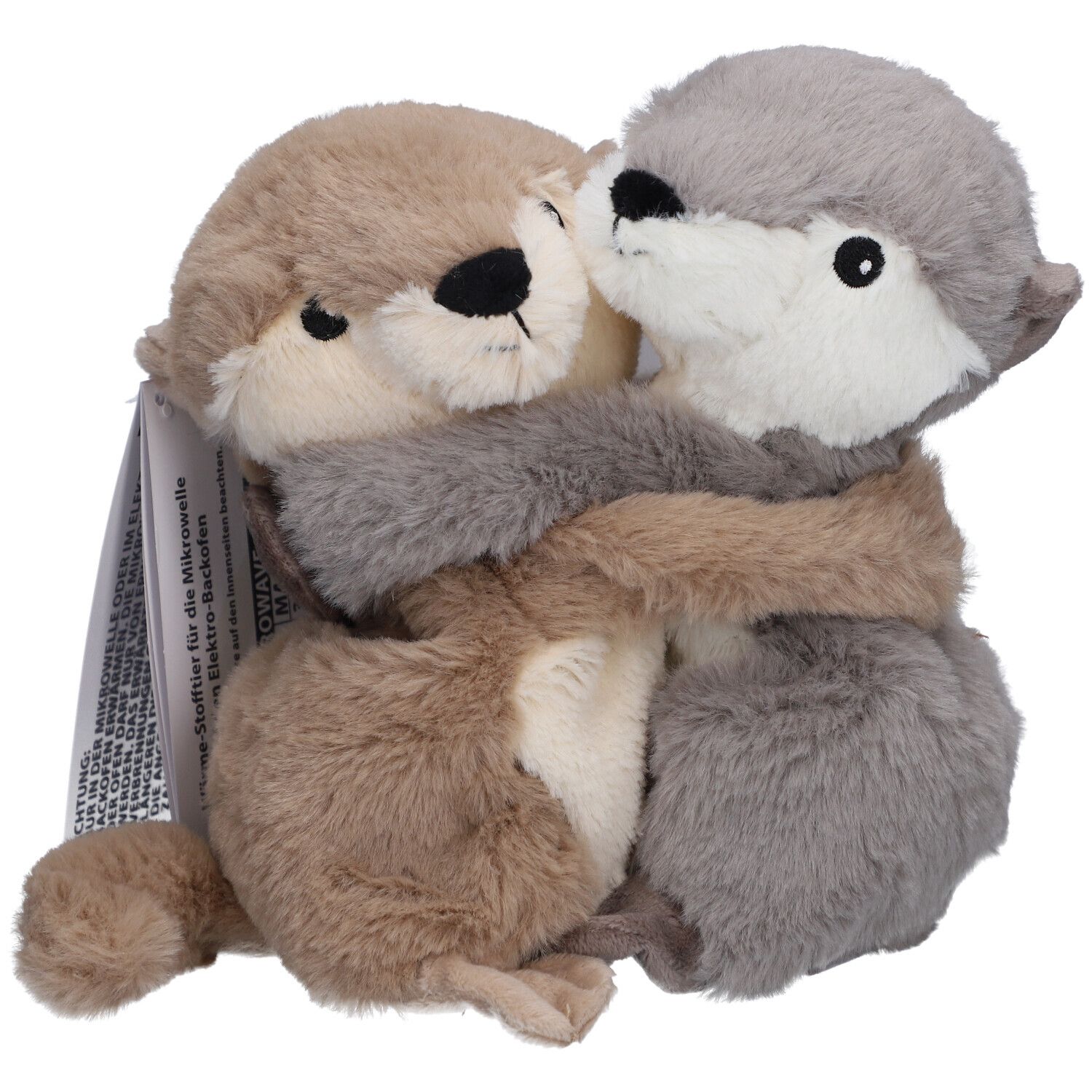 Deux loutres en peluche, beige et grise, s'embrassent. Avec étiquette.