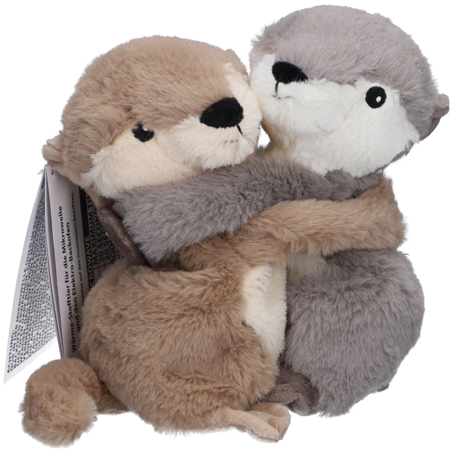 Deux loutres en peluche, beige et grise, s'embrassent. Avec étiquette.