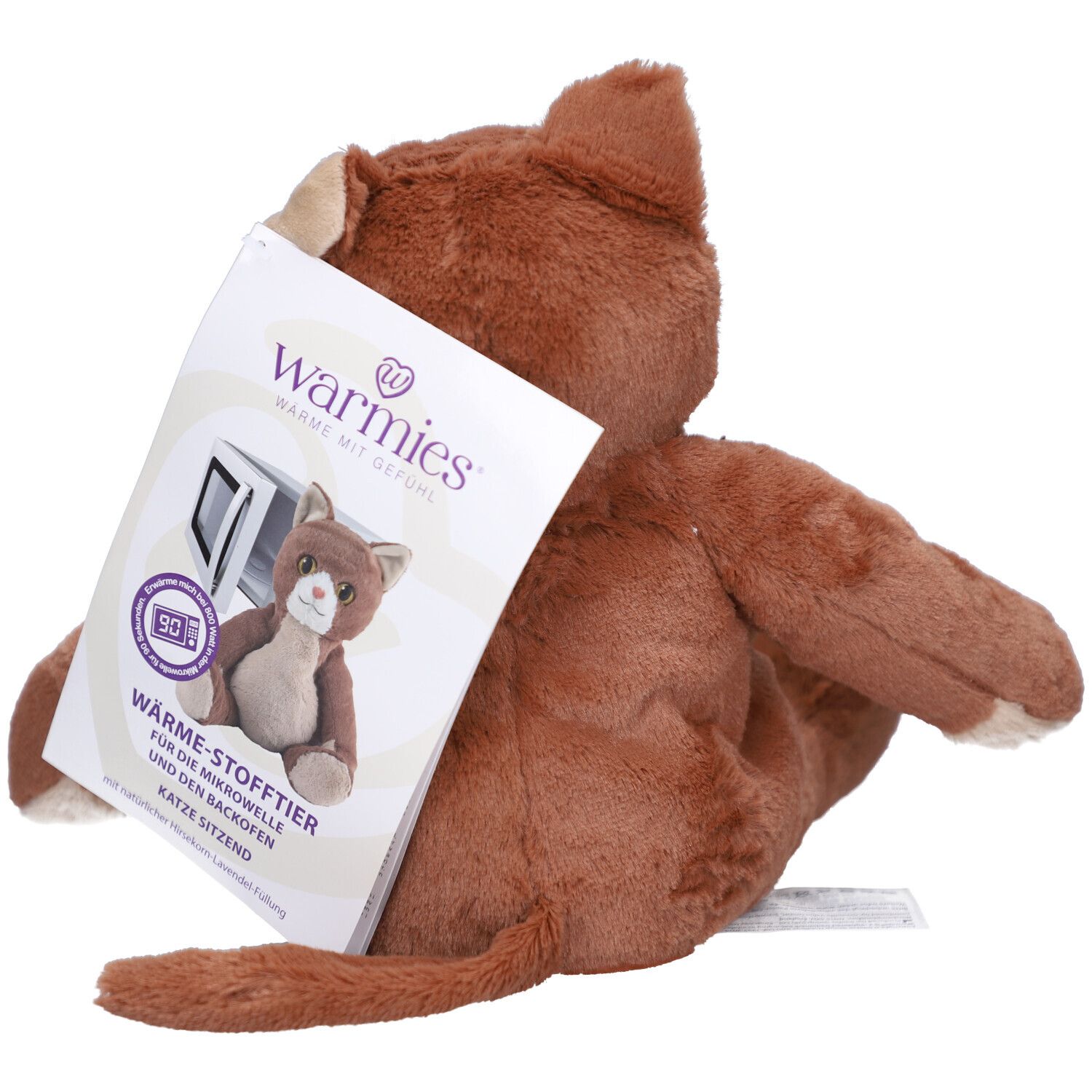 Chat en peluche marron, assis, avec étiquette. L'étiquette montre l'image du produit et le texte: Warmies, chat assis.