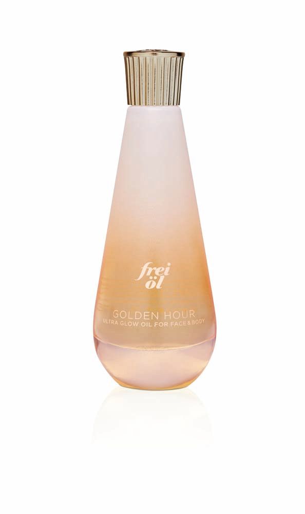 Flacon d'huile frei öl® ULTRA GLOW. Dégradé rose et or. Bouchon doré.