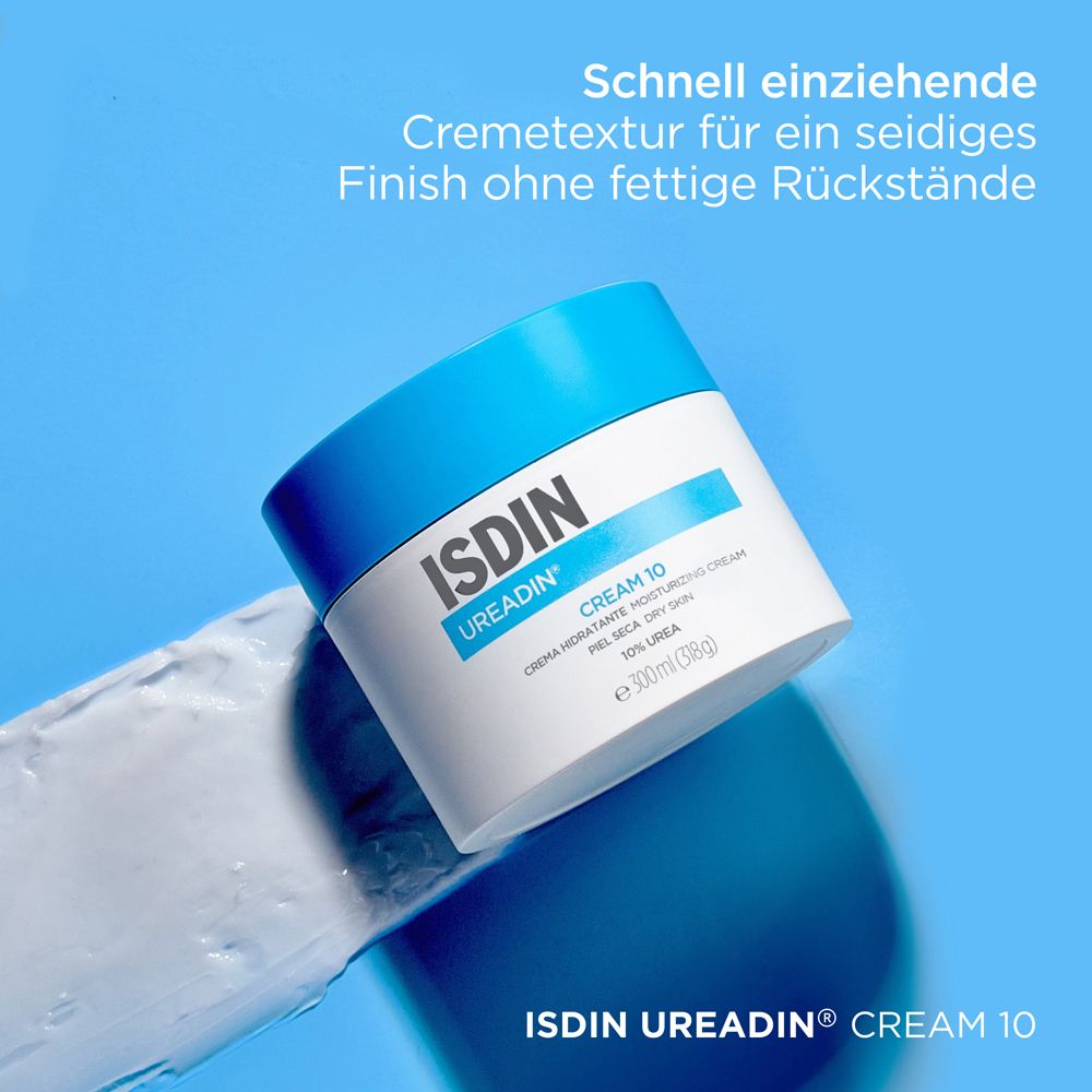 Pot de crème à couvercle bleu. Inscription: ISDIN UREADIN CREAM 10. Texte: Texture crème à absorption rapide.