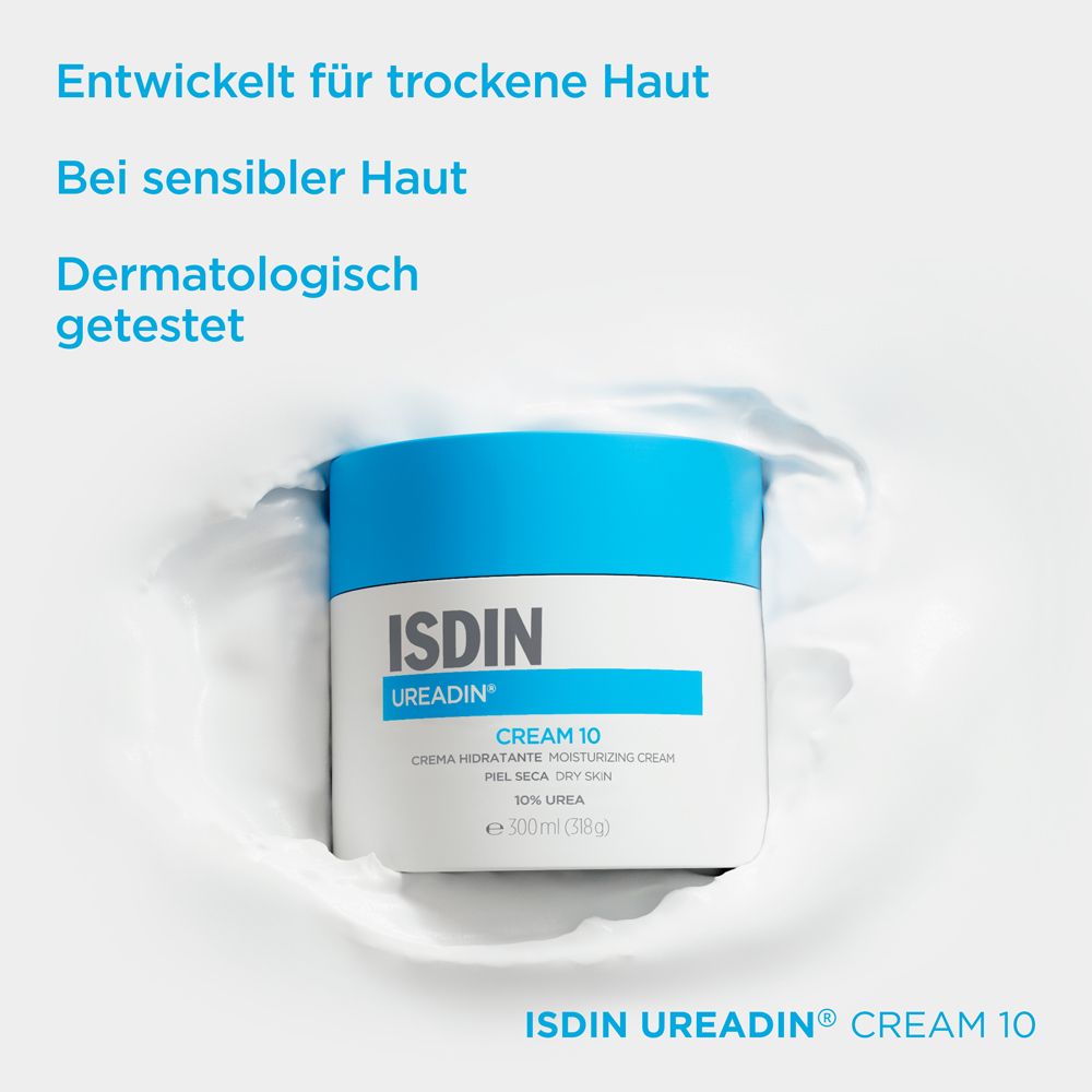 Pot de crème à couvercle bleu. Inscription: ISDIN UREADIN CREAM 10. Texte: Conçu pour les peaux sèches.