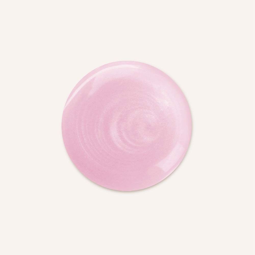Tache rose brillante. Forme ronde. Sur fond clair.
