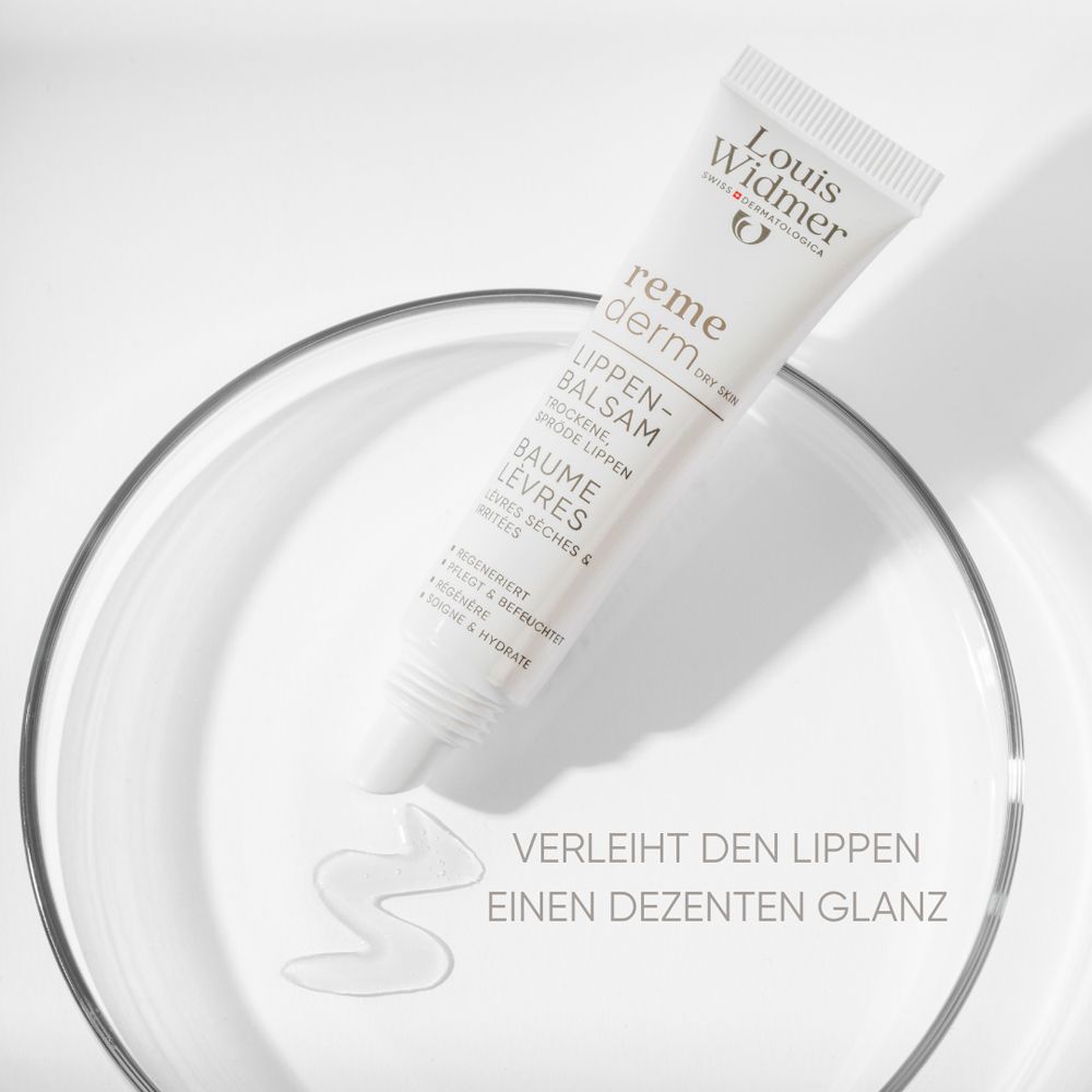 Tube de baume à lèvres dans du verre. Texte: Donne aux lèvres une brillance discrète. Marque: Louis Widmer.