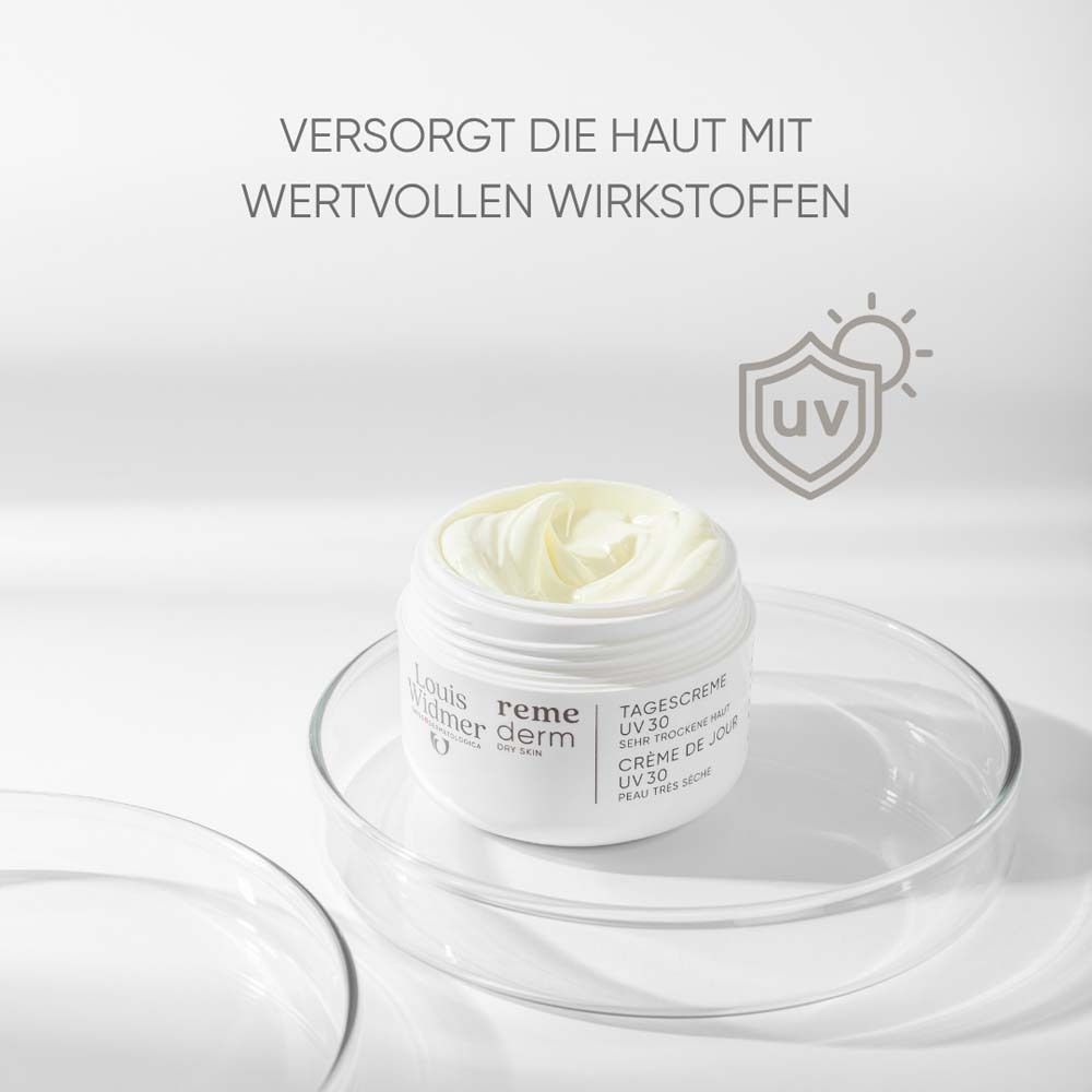 Pot de crème ouvert sur plaque de verre. Texte: Fournit à la peau des ingrédients actifs précieux. Nom du produit: Crème de jour UV 30.