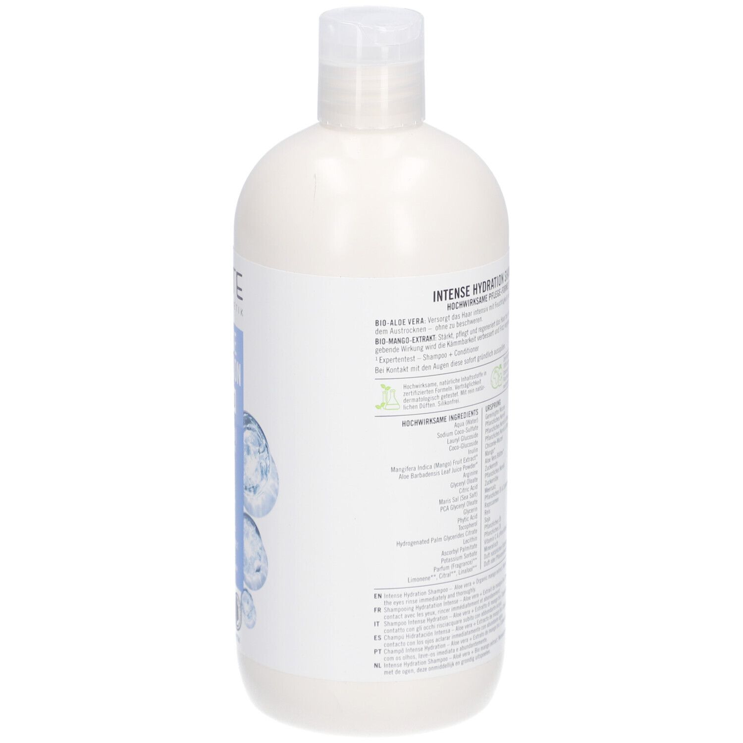 Dos du flacon de shampooing. Texte: ingrédients, instructions d'utilisation. Label Bio, label Vegan.