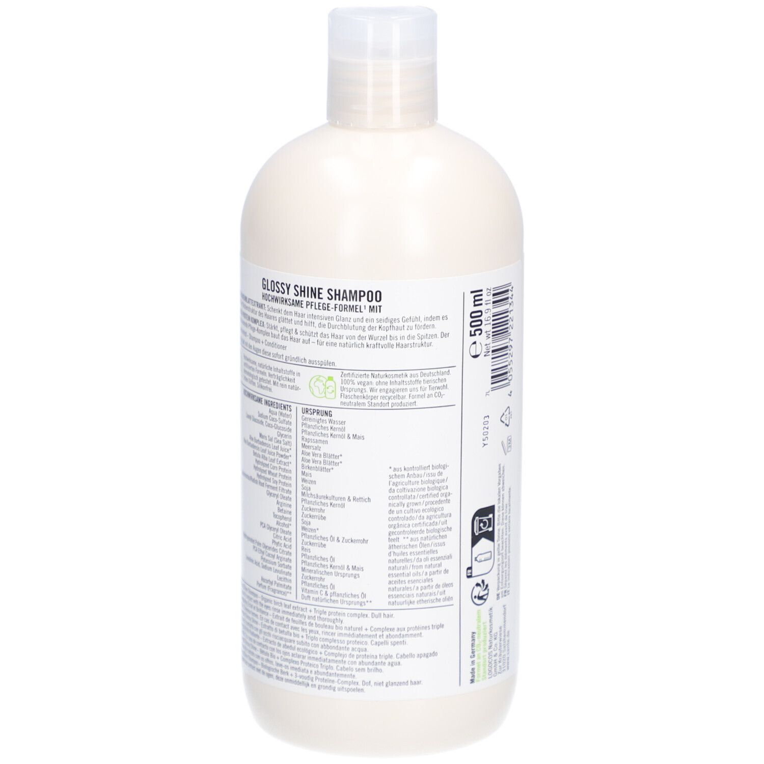 Flacon de shampooing, vue arrière. Étiquette avec informations sur le produit et texte. Label vegan.