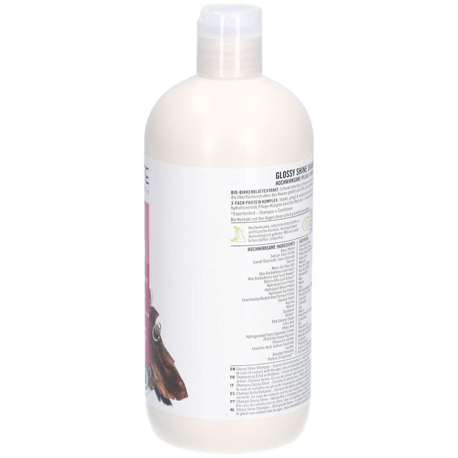 Flacon de shampooing, vue arrière. Étiquette avec informations sur le produit et texte. Label vegan.